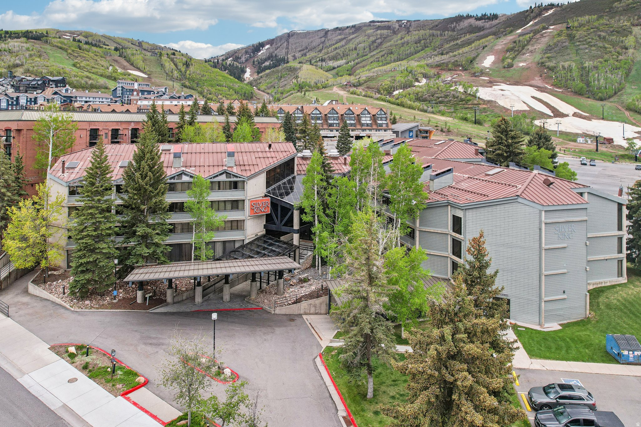 Located steps from the Park City Mountain Resort ski lifts, this Silver King condo offers unmatched convenience for skiing and easy access to Main Street. The fully furnished, turn-key residence includes granite countertops, an in-unit washer/dryer, and HOA dues that cover all utilities. This roomy two-bedroom unit has mountains and ski run views. The property is accompanied by an underground parking garage and a variety of quality amenities designed for relaxation, including a beautiful indoor/outdoor heated swimming pool, sauna, hot tub, a fully equipped gym, and ski locker room. Also, enjoy the added benefit of being on the free Park City bus line, providing quick access to Park City's vibrant historic district, fine dining, boutique shopping, and cultural events. This mountain getaway combines the perfect blend of luxury, convenience, and an unbeatable location to make the most of everything Park City has to offer. Onsite management and front desk check-in add to the ease of ownership.
