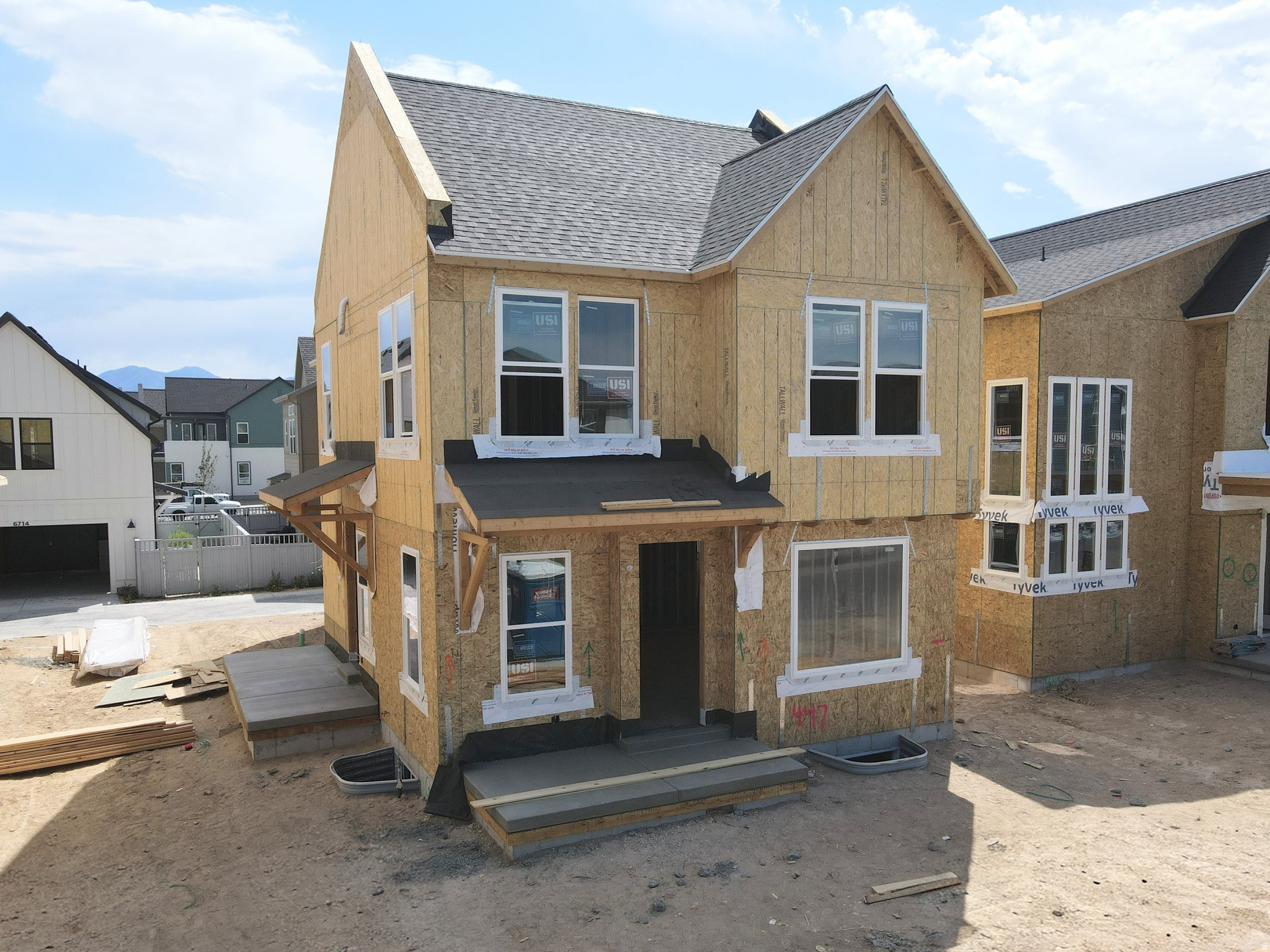 Brand new home under construction featuring a finished basement, full side and backyard landscaping, and designer interior upgrades throughout! This home offers 9-foot ceilings on every level, a grand primary suite, and a versatile loft on the second floor. Stylish details include metal railings and upgraded kitchen cabinetry. The thoughtfully designed floor plan features a spacious living room with a cozy fireplace, seamlessly open to the dining area and kitchen with a large island, perfect for entertaining. A generous walk-in pantry and conveniently located powder room are tucked just off the two-car garage. Photos are of actual home, Estimated October 2026 Completion. *Interior photos are of a previously built home of same plan for example only. Options will vary*