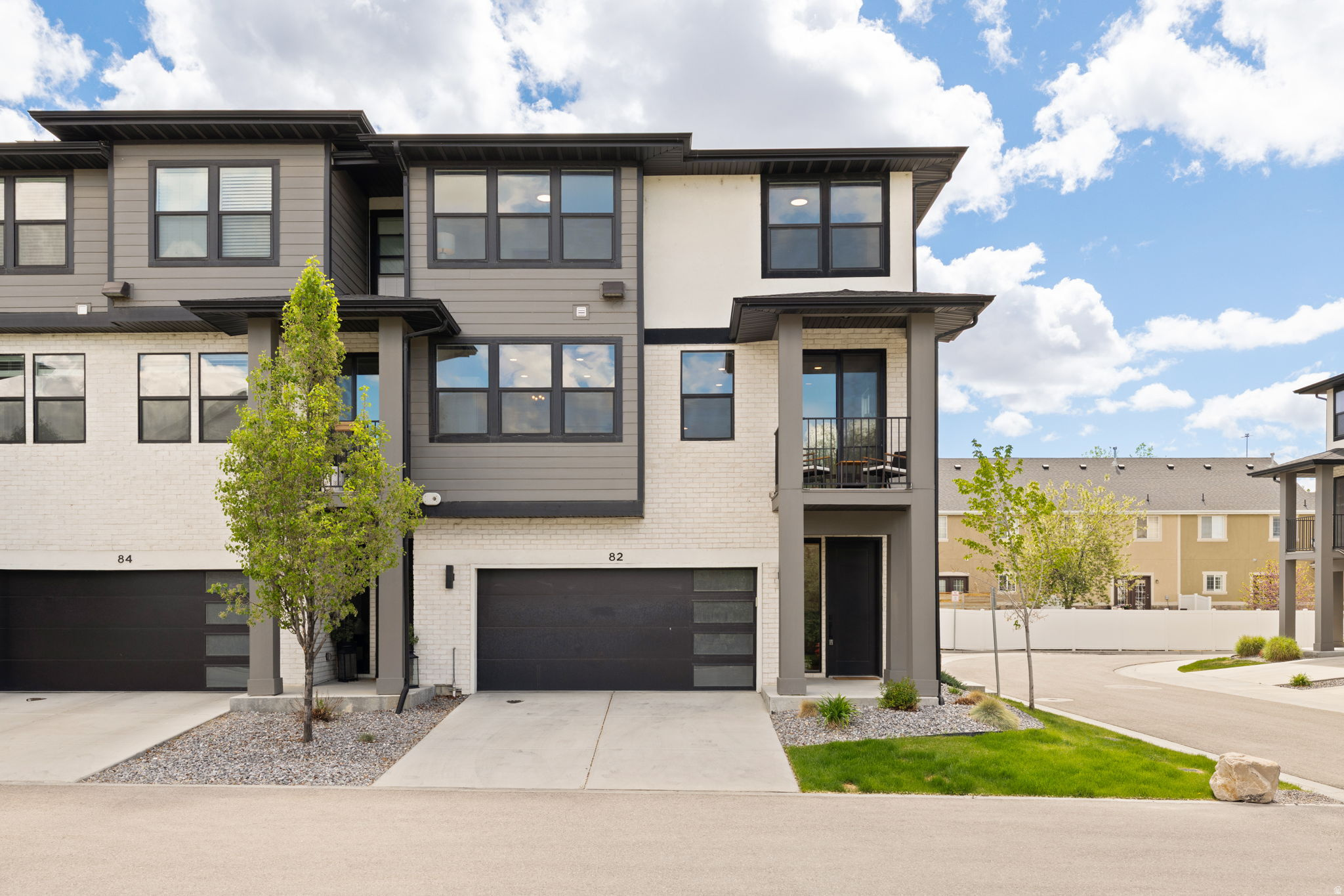 Convenient Draper location with stunning mountain views. Built in 2021, this end-unit offers modern design and a prime location just minutes from I-15, Bangerter Highway, and 12300 S for easy access to shopping and dining. Walk to nearby parks, a splash pad, and dog park.  Inside, you'll find a bright, open layout with abundant natural light. The kitchen features stainless steel appliances, a large island, and sleek countertops - perfect for everyday living and entertaining. The spacious living room opens to a private balcony for relaxing. Ideal as a primary residence or investment property. The home can be sold fully furnished for a truly turn-key property. Make sure to check out the video tour.