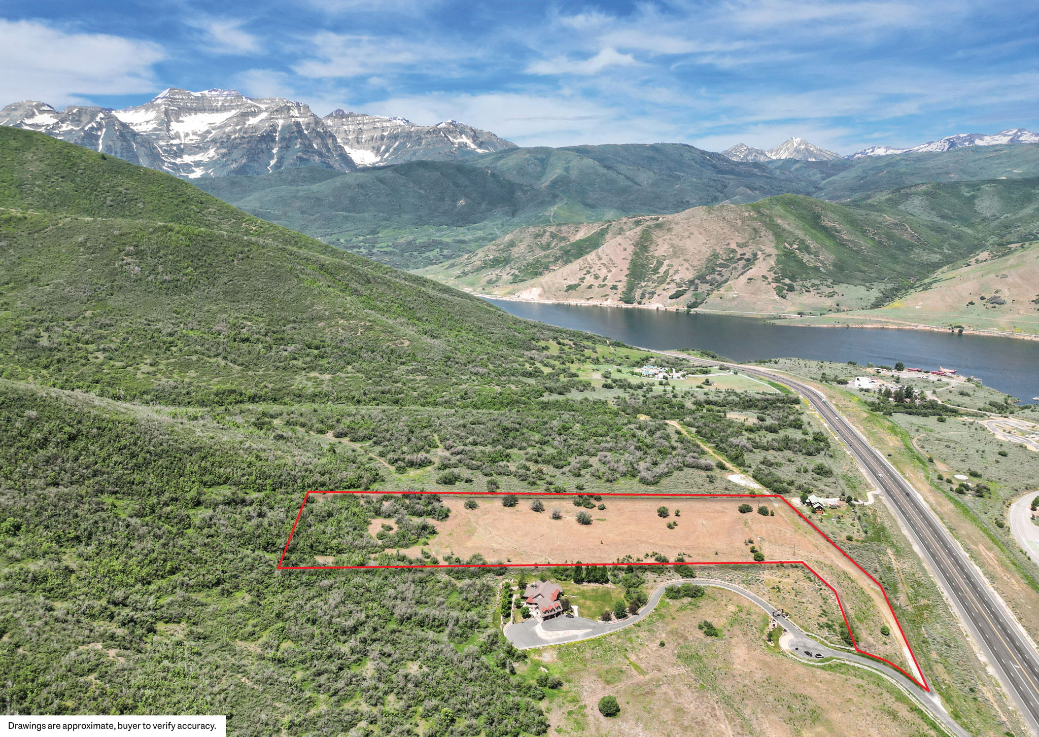 Located on approximately 11 acres overlooking Deer Creek Reservoir, this rare estate parcel captures sweeping panoramic views of the iconic Mount Timpanogos range and surrounding Wasatch Mountains. Opportunities like this are becoming increasingly difficult to find - a private, gently sloping homesite surrounded by large acreage properties, offering the perfect setting to create a legacy mountain retreat designed around privacy, nature, and year-round recreation. With expansive open space, incredible view corridors, and a peaceful setting, the property offers an ideal canvas for a custom luxury residence, equestrian estate, or secluded family compound. Wake up each morning to breathtaking sunrises over the reservoir and spend evenings enjoying the tranquility and natural beauty that define this extraordinary location.  Outdoor recreation is truly at your doorstep. Launch your boat across the street at Deer Creek Reservoir, spend the day fishing or paddleboarding with family, or explore the endless nearby opportunities for hiking, biking, horseback riding, snowmobiling, and backcountry adventure. The property offers the rare balance of feeling completely secluded while remaining conveniently connected to some of Utah's premier destinations.  Ideally located just minutes from Heber Valley, approximately 10 minutes to Sundance Mountain Resort, and within easy access to Utah County and Park City, this exceptional offering combines privacy, accessibility, and world-class scenery in one remarkable setting. Parcels of this size, usability, and view orientation are increasingly rare along the Deer Creek corridor, making this a truly special opportunity to build a one-of-a-kind mountain estate.