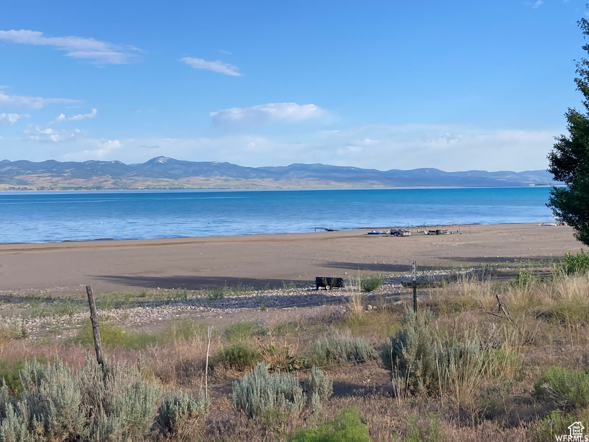 Enjoy breathtaking sunsets from your Sage Hill lot! This desirable lake access building lot is located in the exclusive Sage Hill subdivision on the east side of Bear Lake. The 13-lot lakeside community is an ideal location to build your dream retreat. Call for list of all available lots. Each lot includes a designated building envelope to ensure future lake view preservation. The community offers 100 feet of common area with a sandy beach for resident enjoyment. Please note, short-term rentals are not permitted within the HOA, fostering a peaceful, community-oriented environment. Don't miss your chance to own a piece of lakeside paradise!