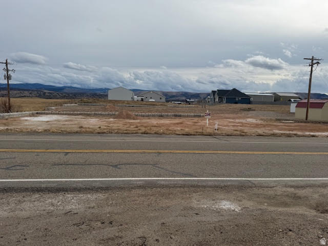 One of the last commercial / Industrial lots available in the Town of Manila!  Located right on Hwy 43 zoned at .47 acre but seller has piped and filled the property in, so its around 2 acres.  Great location for a business and / or a Residents. Property has two flat building areas divided by decorative 4x2 blocks.