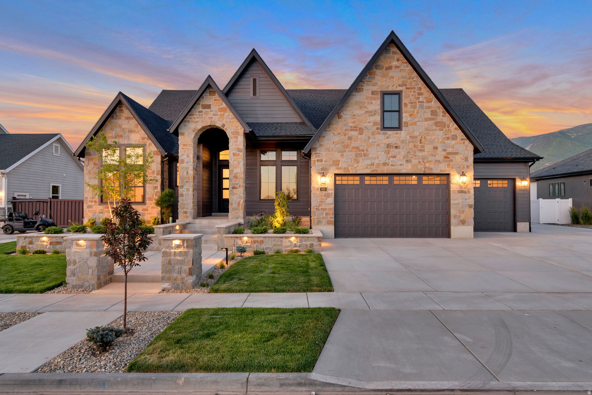 STOP SCROLLING-this is the one buyers regret missing. Lot #408 is currently under construction and sits on a deep, private + acre lot, offering rare space and flexibility. A true standout is the massive detached garage (50' deep x 28' wide with 12' ceilings and 2x6 walls), plus a 42' deep third bay in the attached garage-ideal for cars, toys, or hobbies. Inside, enjoy a luxurious Owner's Suite with oversized shower, dual vanities, freestanding tub, and custom walk-in wardrobe with laundry hookups. The finished basement includes 3 bedrooms. 1 of them with en-suite  bath, full laundry room, and kitchenette-perfect for guests or multigenerational living. A designer kitchen features an oversized butler's pantry, 48" dual-fuel professional range, and commercial-grade built-in fridge/freezer. Fully landscaped with an outdoor sports court. Built with exceptional craftsmanship by renowned local builder Symphony Homes-homes like this don't last.