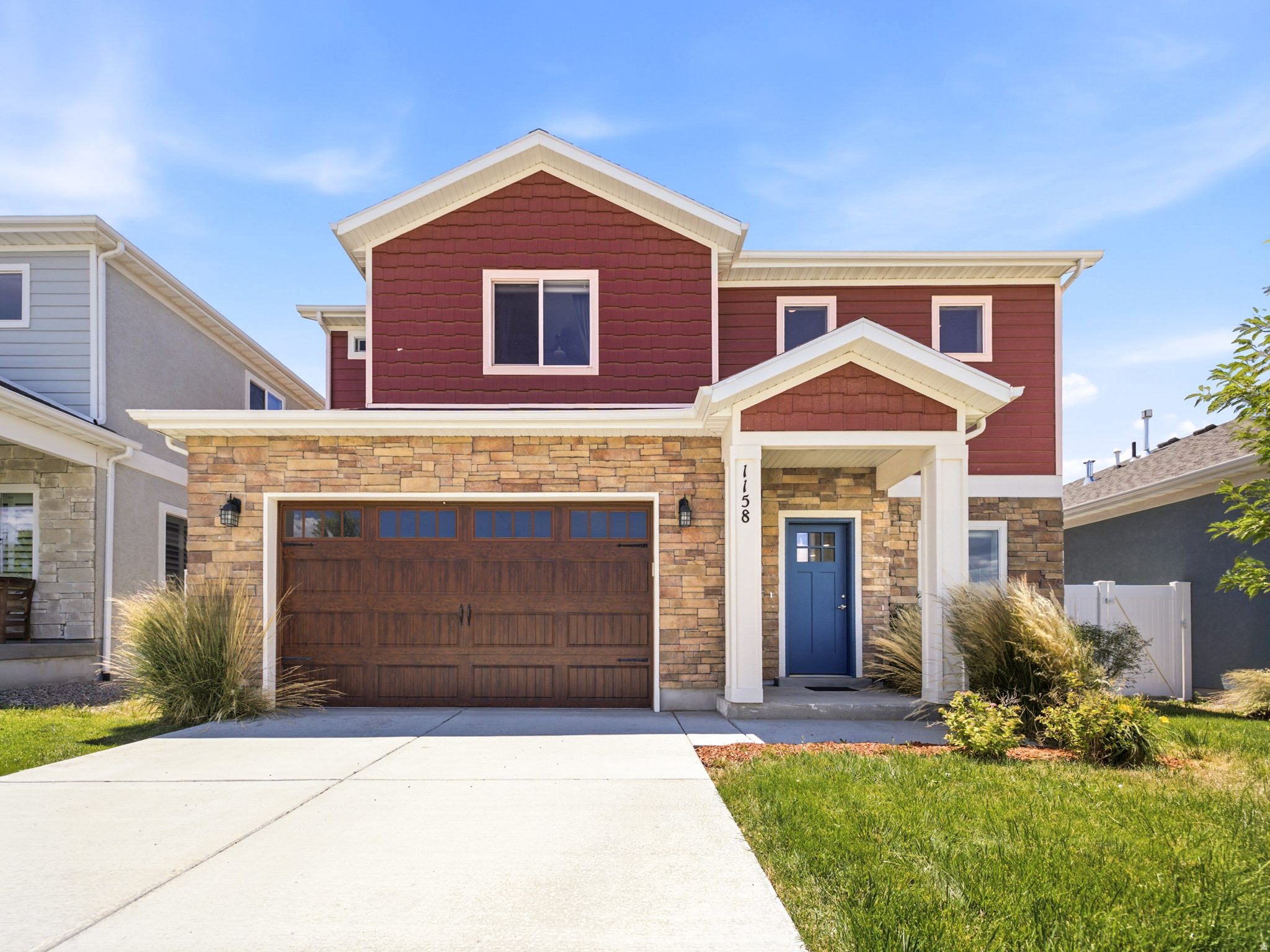 This beautifully maintained four bedroom, two and a half bath home offers the perfect blend of style, comfort, and value in one of Heber City's sought after newer neighborhoods. Built in 2021 and feeling nearly new throughout, the home features durable LVP flooring on the main level and laminate flooring extending upstairs, so the only carpet in the entire home is downstairs, a great perk for pet owners or anyone who prefers to skip carpet altogether. The open concept living space is anchored by a cozy fireplace and flows into a kitchen finished with quartz countertops and generous cabinetry, with the refrigerator, washer, and dryer all included for a truly move in ready opportunity. Upstairs, the primary suite is a standout with double sinks, a walk in closet, and a beautifully tiled shower that feels like a true retreat, while outside the fully fenced backyard offers privacy and an oversized covered patio, larger than most in the neighborhood thanks to a few extra feet gained during construction, plus a two car garage rounds out the package. Just minutes from Deer Valley East Village, Park City, Jordanelle Reservoir, championship golf, blue ribbon fishing, hiking, and skiing, this home puts you close to everything Heber Valley living has to offer while keeping the charm of a welcoming mountain community, and it is currently the best value for a two story home in the neighborhood.
