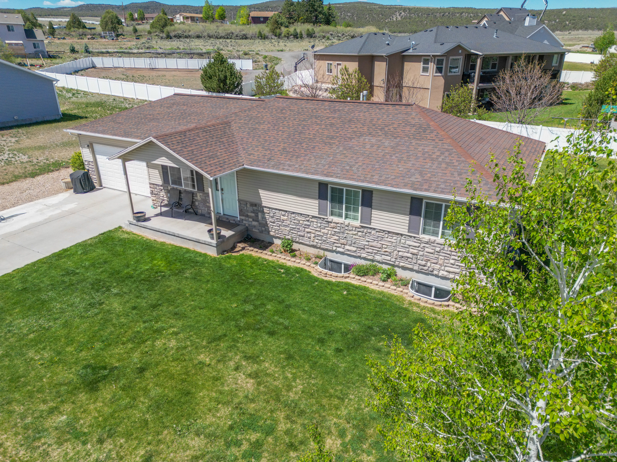 Impressive, attractive home with a bonus building lot! Included are two parcels: one 0.25-acre parcel for the home and one 0.30-acre corner building lot. This property opens up many possibilities, including selling the adjacent lot, enjoying extra space, or keeping the additional property as an investment. Home is in move-in-ready condition, but it could use some updating. Great opportunity to invest time and effort to build equity. Key lovable features include a newly finished basement (2025), new instant hot water heater (2023), modern and functional bathrooms, and a large primary suite with walk-in closet. Seller may consider a flooring credit of up to $5,000 dependent on offer. Unique opportunity to live in a beautiful yet improvable home with a building lot right next door--all in a beautiful area at the door to endless outdoor adventure. *Square footage figures are provided as a courtesy estimate only. Buyer is advised to obtain an independent measurement.