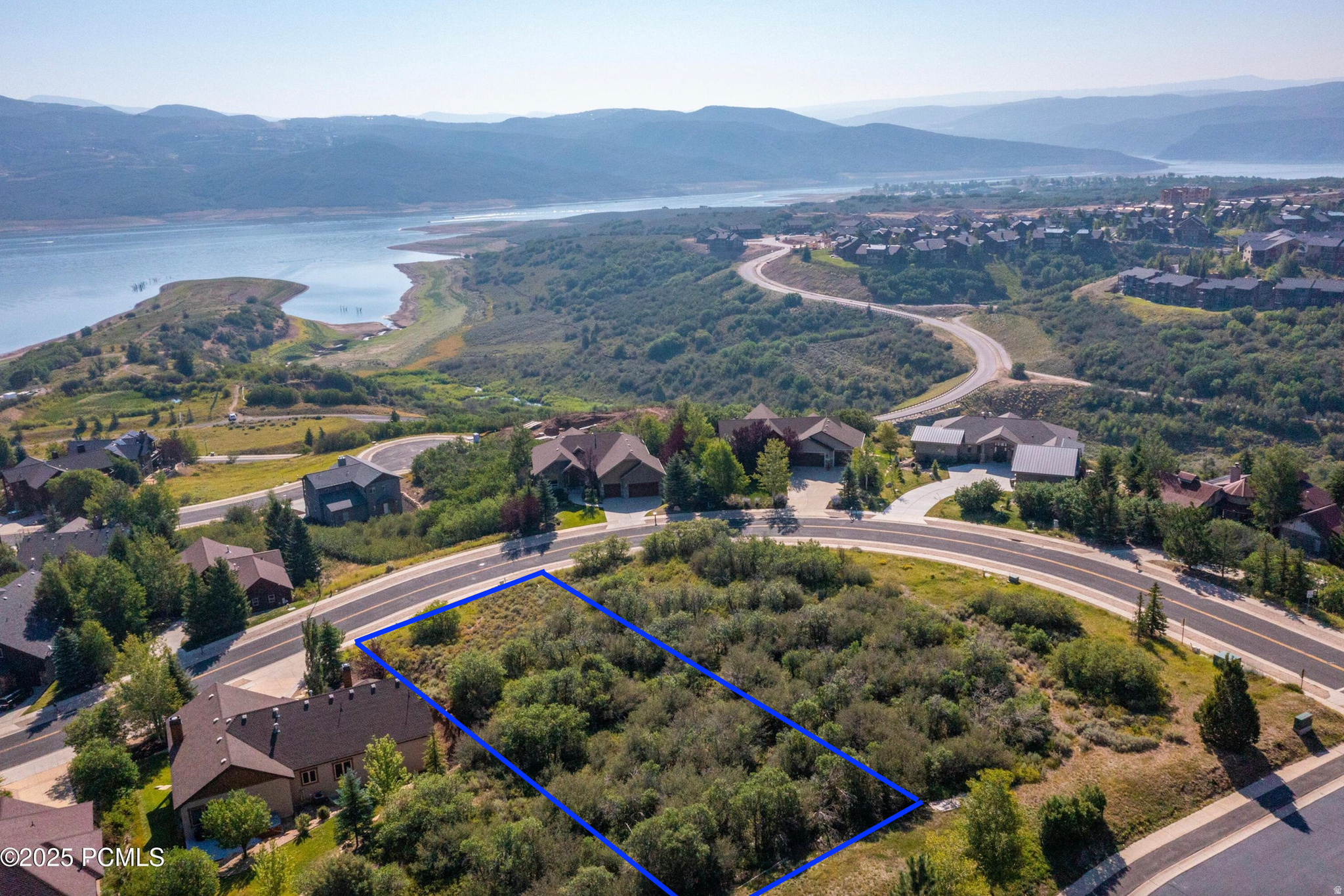 Discover an exceptional opportunity to build your dream home in the prestigious Star Harbour Estates community. This .55-acre homesite offers breathtaking panoramic views of Deer Valley Resort, Jordanelle Reservoir, and the surrounding Wasatch Mountains, creating the perfect backdrop for a custom mountain retreat. Located just 5 minutes from Deer Valley East Village, you'll enjoy unparalleled access to world-class skiing, while Jordanelle Reservoir is just moments away for boating, paddle boarding, fishing, and endless summer recreation. Whether you're seeking adventure or relaxation, this location offers the very best of Utah's four-season lifestyle. With Park City just 10 minutes away and Salt Lake International Airport within 45 minutes, you'll enjoy the perfect balance of convenience, recreation, and mountain living. Don't miss this rare opportunity to own a premier view lot in one of the area's most sought-after locations. Be sure to watch the attached video to fully experience the incredible setting and views.