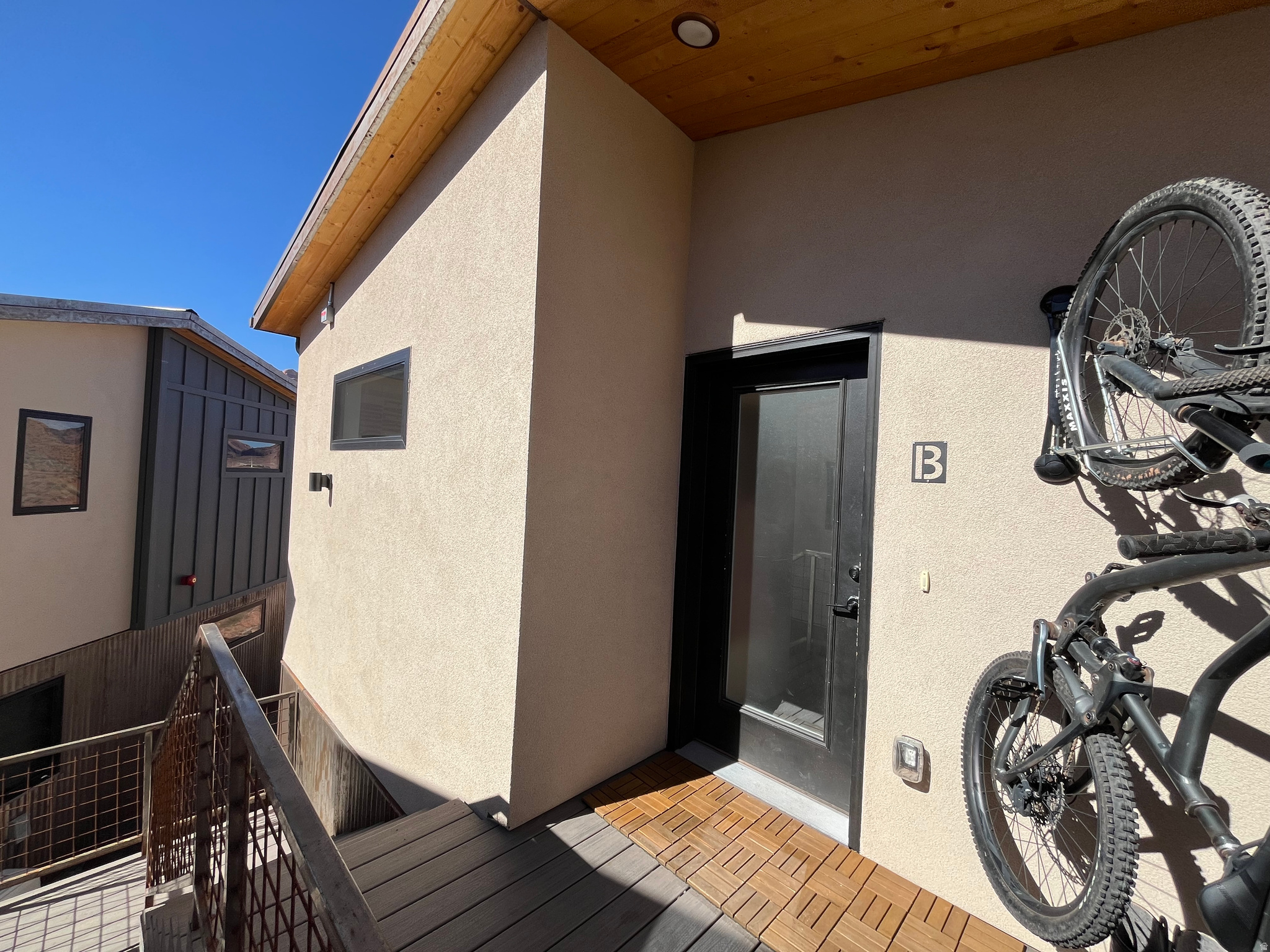 REDUCED PRICE -LOCAL INVESTOR or PRIMARY RESIDENCE UNIT in Murpy Flats Unit 202B - Beautifully maintained 2 bed, 1 bath elevated second-level condo offering modern comfort and unbeatable access to Moab's adventure lifestyle. At 614 sqft, this is the only two-bedroom unit currently available in the community, making it a rare opportunity for buyers. Enjoy an open, efficient floor plan with thoughtful design throughout, maximizing both space and function. The home is in amazing condition and features a private balcony with stunning views of the Moab Rim. This unit includes 2 deeded parking spaces, a private storage unit, and covered bike parking-perfect for all your outdoor gear. Murphy Flats offers exceptional shared amenities including a community garden, fire pit, and dog park, all within a welcoming neighborhood less than two miles from downtown Moab.  All information deemed reliable by the listing office; buyer to verify all.