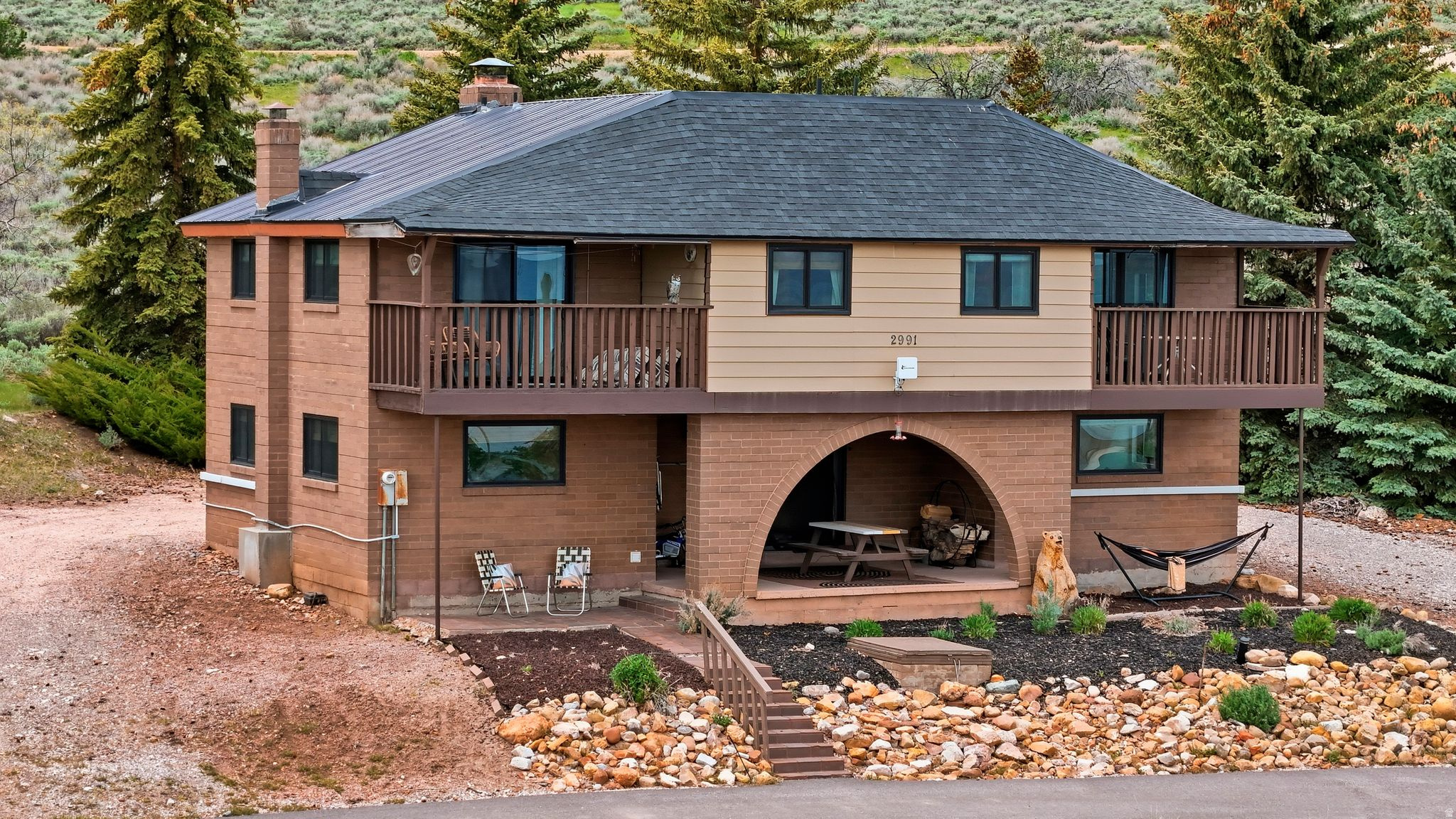 Phenomenal view of Bear Lake.  Newly remolded master bathroom and a wet bar, new roof and mini splits in 2020, windows and sliders new in 2023,.  Selling cabin mostly furnished!  Ask what is included.  Two storage sheds.  Mature trees surrounding the cabin.  Two decks on second floor and three covered patio areas with views.  Perfect for years of memories!