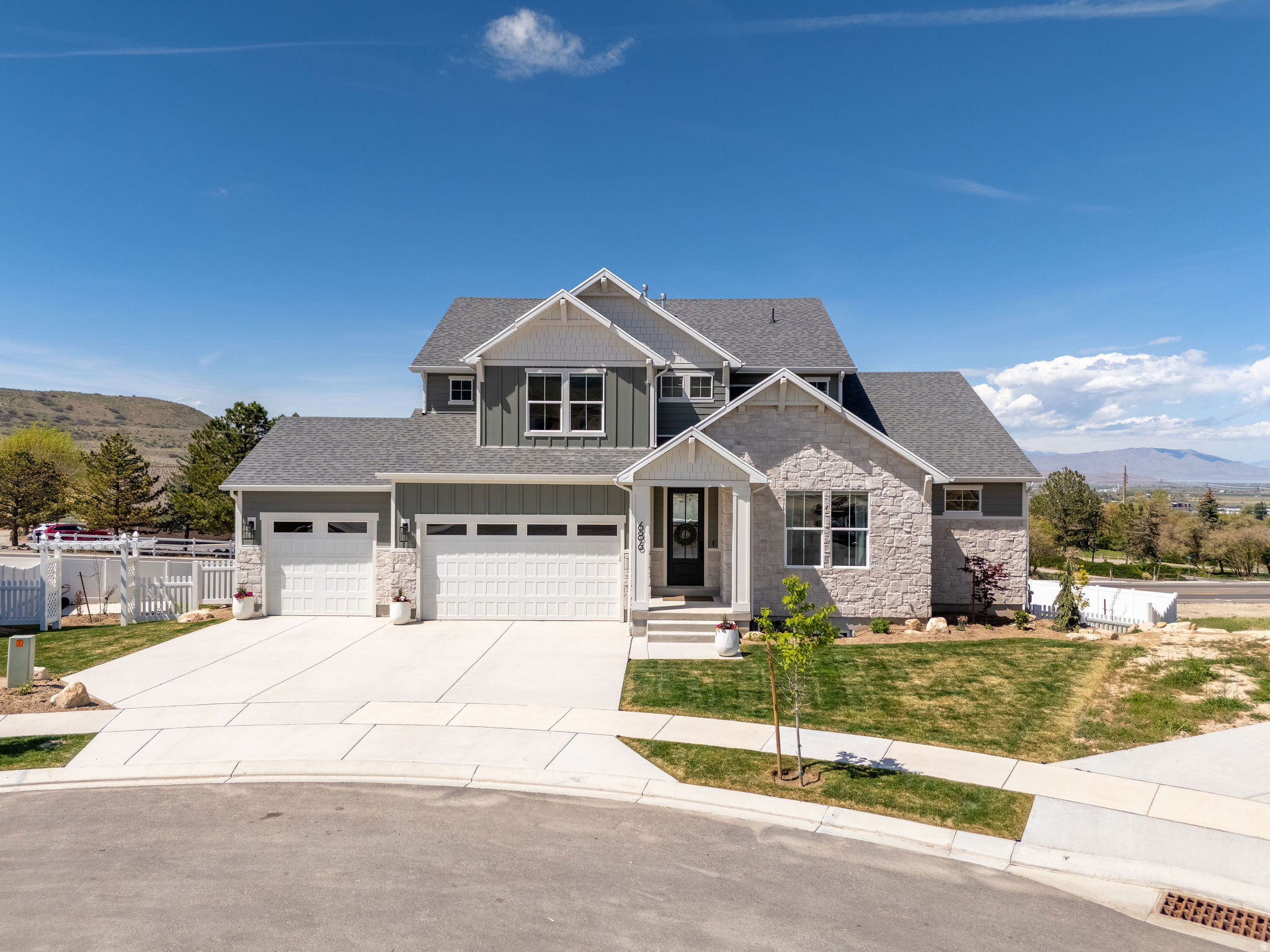 Tucked away in a quiet cul-de-sac, this home offers a spacious yard and stunning mountain views. The light filled, open-concept design showcases a beautifully designed kitchen with double ovens, a gas range, a large walk-in pantry, and under-cabinet lighting with built-in outlets. A generous private office creates the perfect space for working from home or focused study.  The primary suite features a spacious walk-in closet with its own private laundry, complemented by a second upstairs laundry room for added convenience.  The walkout basement offers 9-foot ceilings and is already plumbed for a future kitchen, providing exceptional potential for additional living space.