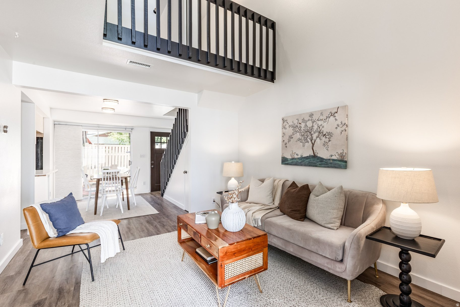 Welcome home to this charming townhouse nestled in the peaceful Willows community-an ideal setting for quiet living surrounded by nature. Enjoy beautifully maintained grounds with a tranquil pond, nearby stream, and mature trees that create a true sense of retreat. Inside, the home has been thoughtfully updated with LVP flooring and fresh paint. The open floor plan is filled with natural light and enhanced by soaring ceilings, creating an airy, inviting feel throughout. A cozy front patio and a private grassy backyard offer great spaces for relaxing or entertaining. Additional features include a shared 1-car garage, extra parking, and convenient guest parking. Residents also enjoy access to a community pool and clubhouse. The HOA covers gas, water, sewer, garbage, snow removal, exterior maintenance and insurance, as well as use of amenities. Ideally located with easy access to ski resorts, hiking and biking trails, schools, shopping, and dining-this home offers both comfort and convenience in a serene setting. No Current Rental Cap is in place if you're interested in using the unit as a rental.