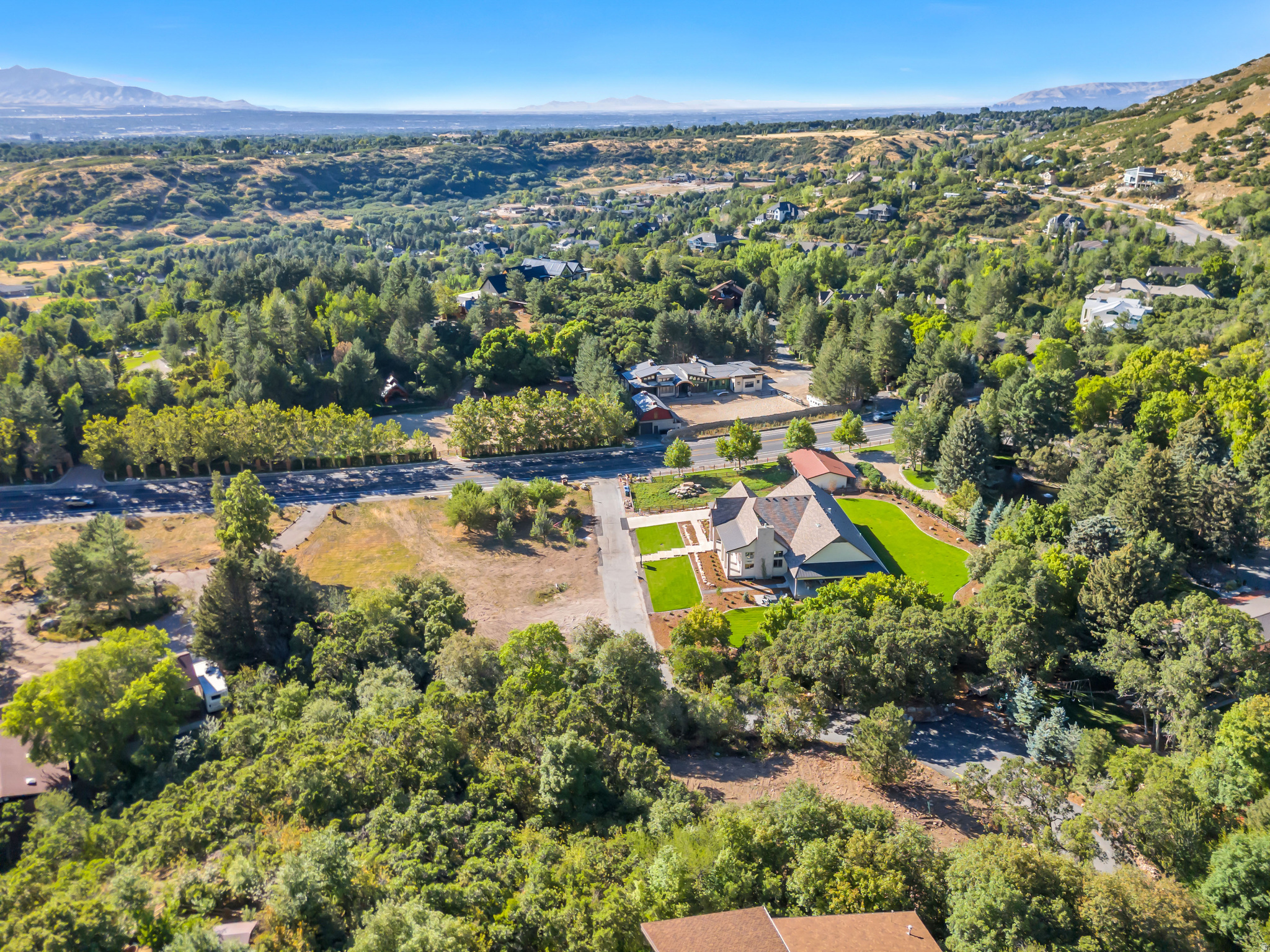 Incredible One Acre Estate Lot in Secluded, Luxury Setting with Panoramic City & Mountain Views. The Perfect Spot to Build your Dream Home. Situated just south of Little Cottonwood Canyon, this property places you minutes from world-class skiing, hiking, and biking-an outdoor enthusiast's paradise. Break ground tomorrow. Use our builder or have the freedom to use your own. Permit ready, city approved engineered plans are included. See pictures for possible home plans and renderings. For more details of home plans and renderings please see MLS # 2102120 $2,920,000 which includes the home built on the land.