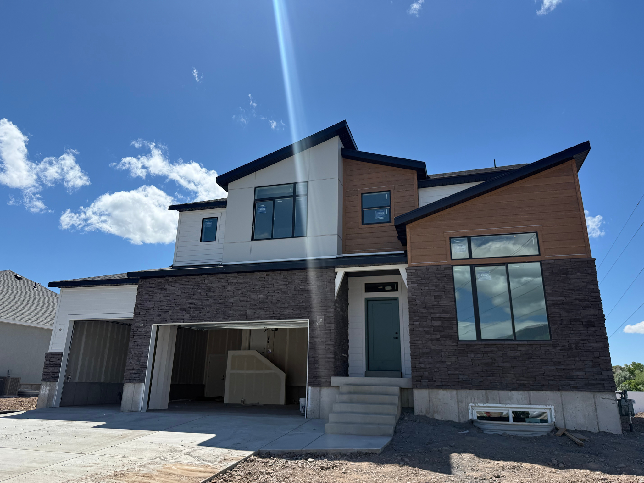 Lock this property down before it's finished! Our Glacier Floor Plan in Riverwood is one you won't want to miss. This beautiful home features 4 bedrooms, 2.5 bathrooms, and a thoughtfully designed layout that offers the perfect space for hosting, gathering, and everyday living. Showcasing one of our newest exterior designs, the Mountain Modern, this home delivers eye-catching curb appeal with a fresh, elevated look. Inside, you'll find spacious living areas ideal for entertaining, along with quality finishes and a layouts. In the kitchen you'll find the quartz countertops, offering both style and durability for daily use. Open-concept living spaces create a warm and inviting atmosphere perfect for everything from quiet nights in to weekend get-togethers. The primary suite serves as a relaxing retreat, featuring double sinks, a separate shower and soaking tub, perfect for unwinding at the end of the day. Additional bedrooms provide flexibility for guests, or a home office. Plus, you'll have a blank canvas in the basement ready to become a home gym, craft room, theater space, or anything your heart desires. Located in the desirable Riverwood community, you'll enjoy convenient access to I-84, Highway 89, and Hill Air Force Base, making commuting and daily errands convenient. Don't miss your chance to secure this beautiful home before construction is complete!