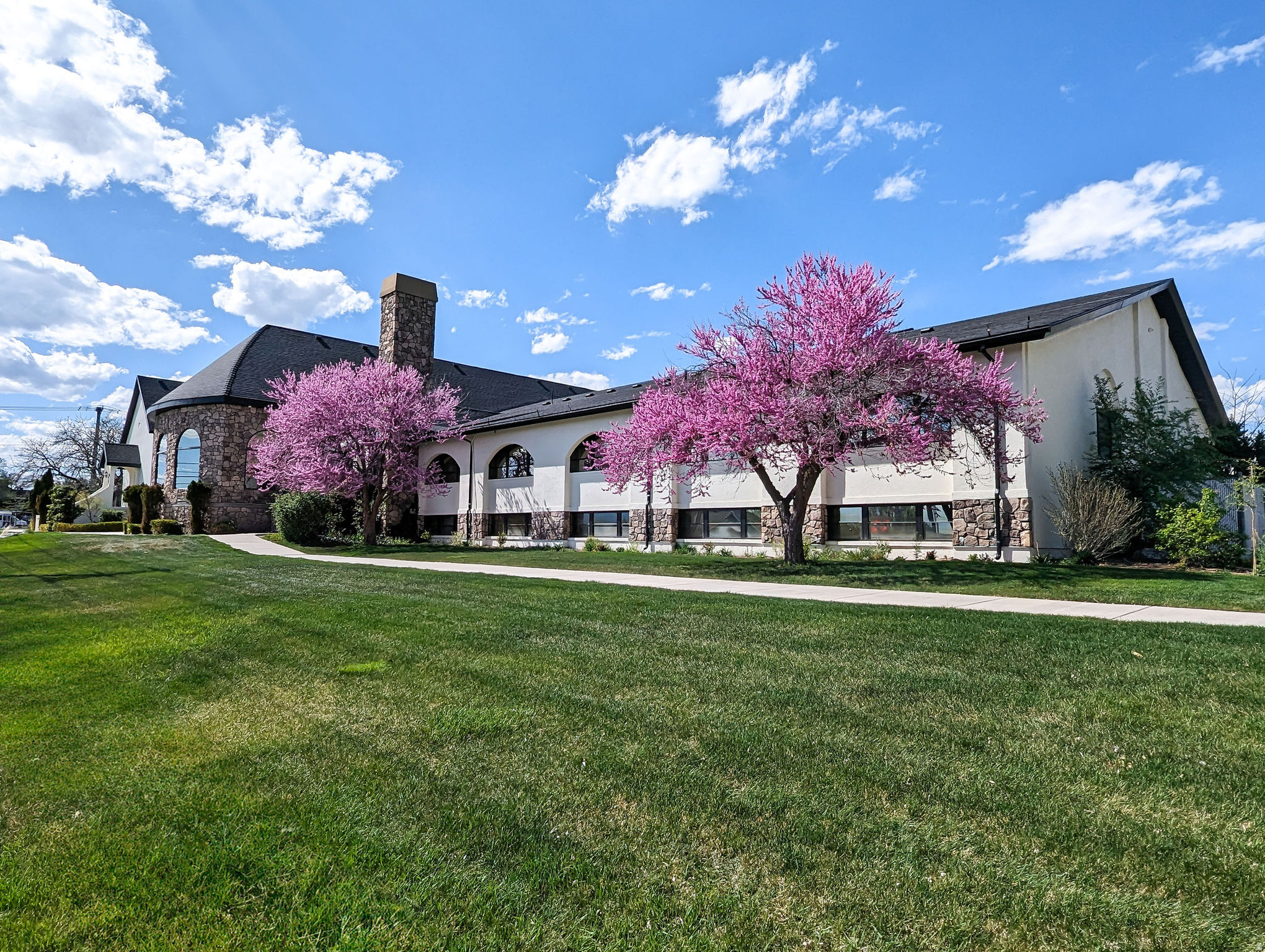 Stone Gate Events Center is a rare, historic event property located in Pleasant Grove, Utah, spanning 20,405 SF on 2.803 acres. Originally built in the late 1800s as the Old Manila Church, this timeless venue blends historic character with modern functionality. The property features three distinct indoor event spaces-The Candlelight Chapel, Grand Ballroom, and Great Hall-along with beautifully landscaped outdoor venues including the Hidden Grove amphitheater. Additional highlights include a commercial kitchen, manicured grounds, and strong infrastructure for high-capacity events. Thoughtfully restored and continuously improved by dedicated ownership, Stone Gate has hosted over 1,000 events and remains a premier destination for weddings, celebrations, and community gatherings. This is a unique opportunity to acquire an iconic, income-producing property with deep historical significance and enduring appeal.