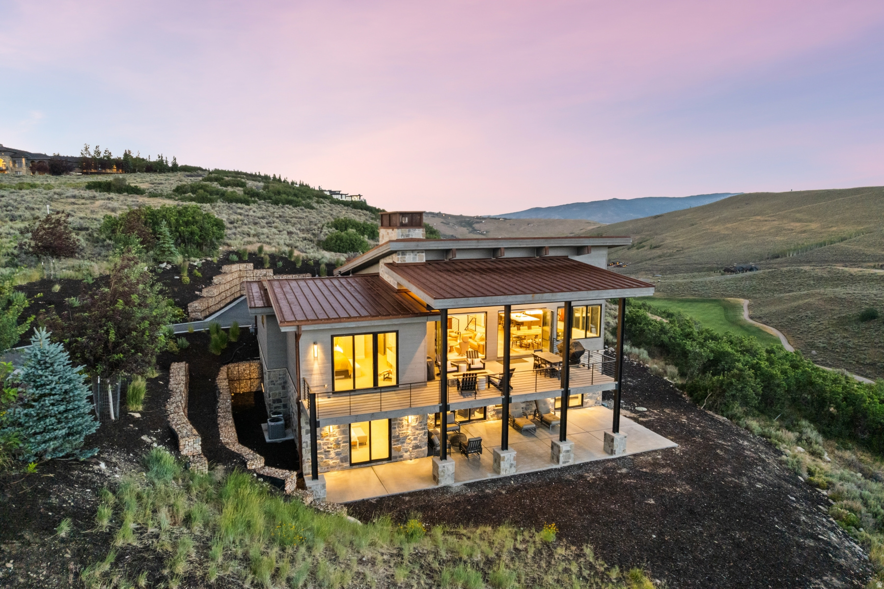Central Promontory Living with Deer Valley Views & Full Golf Membership Available -- Perfectly positioned in the heart of Promontory, this beautifully designed mountain contemporary home combines exceptional convenience with views of Deer Valley's Bald Mountain and the Nicklaus Golf Course. Located in Promontory's Painted Shores neighborhood you'll enjoy quick access to the Beach Club, Nicklaus Clubhouse, Dye Clubhouse, Village Clubhouse, and Promontory's Equestrian Gate for an easy drive to Park City or Salt Lake City. Designed for gathering, the home's open-concept great room, dining area, and chef's kitchen are framed by soaring ceilings, expansive windows, and walls of glass that open to a spacious covered deck complete with outdoor dining, lounge seating, and a fire feature. Together, these spaces create the perfect setting for entertaining while taking in the surrounding mountain landscape. Offering 5 bedrooms, the thoughtful floor plan provides comfortable accommodations for family and guests alike. The lower level features a dedicated game room with space for a pool table, game table, and additional entertaining, creating a wonderful gathering area for all ages. Additional highlights include a backup generator for added peace of mind, generous outdoor living spaces, and an oversized three-car garage. A Full (Golf) Membership is available through separate purchase, allowing the next owner to enjoy immediate access to Promontory's award-winning golf courses and extensive private club amenities without waiting for future membership availability.