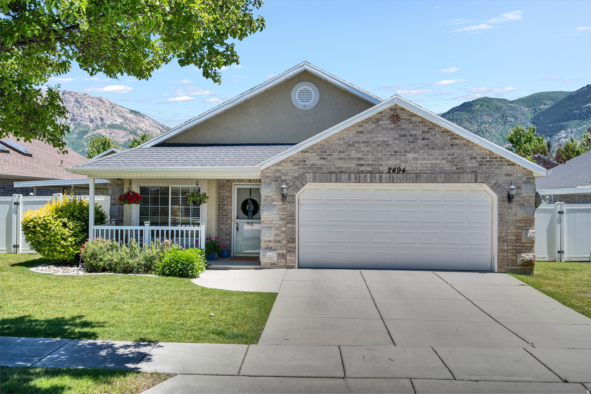 Beautiful and well-maintained, single-level living in The Cottages, a 55+ community. This home features 3 bedrooms, an open layout, vaulted ceilings, and two large bathrooms. Enjoy a private, fully fenced yard and the peace of mind of a new HVAC system. The HOA fee conveniently covers front yard maintenance and snow removal.