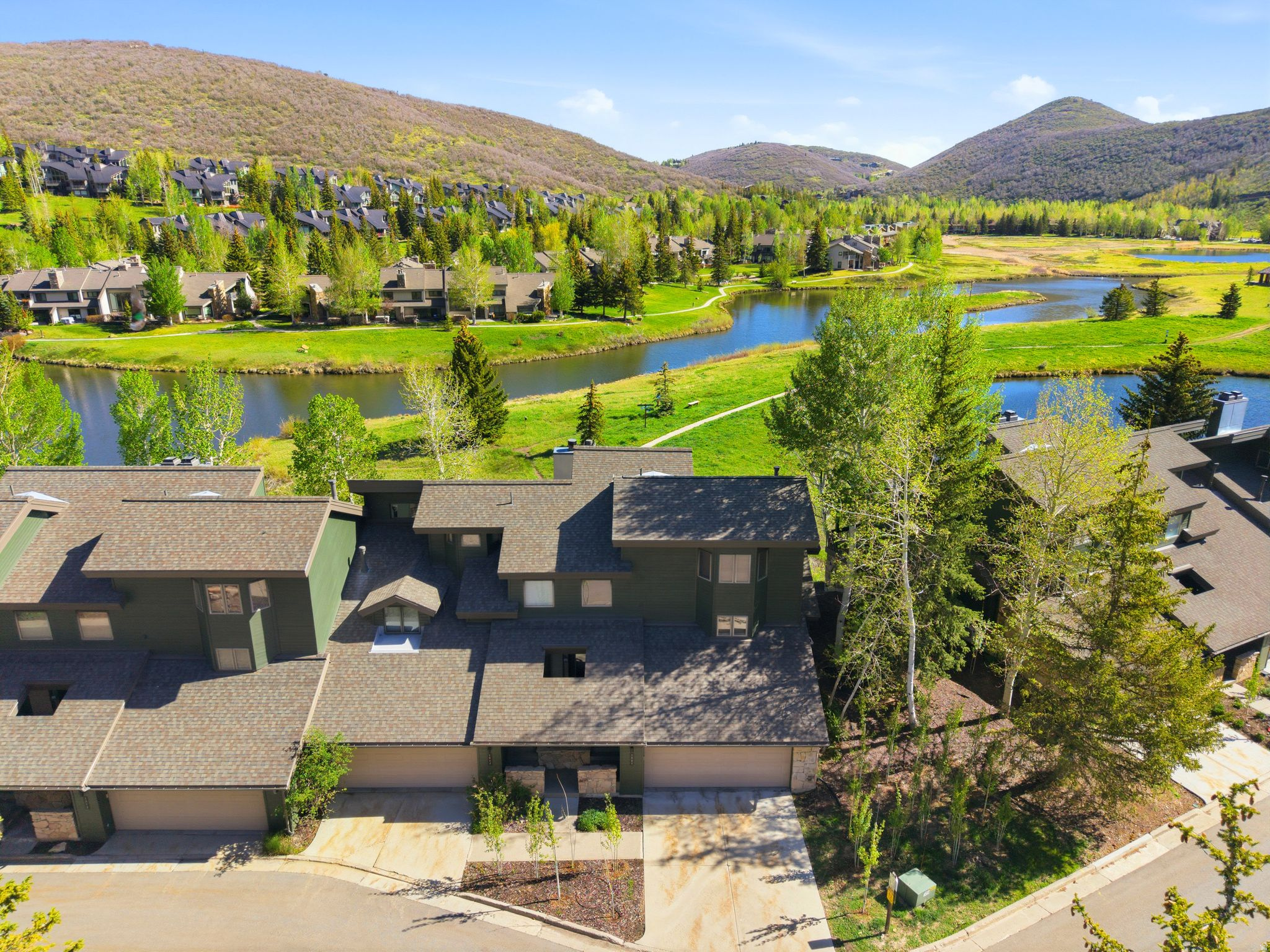 Perfectly positioned in the heart of Lower Deer Valley, this beautifully reimagined 4-bedroom Lakeside townhome offers a rare combination of serene pond views, walkable convenience, and refined mountain living. Ideally situated between Snow Park Lodge and Park City's Historic Main Street, the location delivers effortless access to skiing, dining, shopping, and year-round recreation. Completely remodeled in 2023, the residence showcases high-end finishes throughout, including wide-plank European white oak flooring, premium granite and quartzite countertops, and top-tier appliances that elevate both form and function. The open-concept main level is designed for gathering, with a welcoming living area and seamless flow to generous deck space overlooking the tranquil Deer Valley ponds - an ideal setting for morning coffee or aprs-ski evenings. The thoughtful layout includes a spacious primary suite and two additional bedrooms, offering comfort and privacy for family and guests alike. Large windows bring in natural light and frame peaceful outdoor views, reinforcing the home's connection to its surroundings. Lakeside residents enjoy exceptional amenities, including a year-round heated pool, hot tubs, sauna, and an on-demand door-to-door skier shuttle to Snow Park Lodge. With ongoing HOA improvements and proximity to hiking, biking, skiing, and Main Street, Lakeside continues to be one of Deer Valley's most desirable and beautifully maintained communities. Whether used as a primary residence, mountain getaway, or investment property, this turnkey Lakeside townhome delivers timeless style, unbeatable location, and true year-round enjoyment.