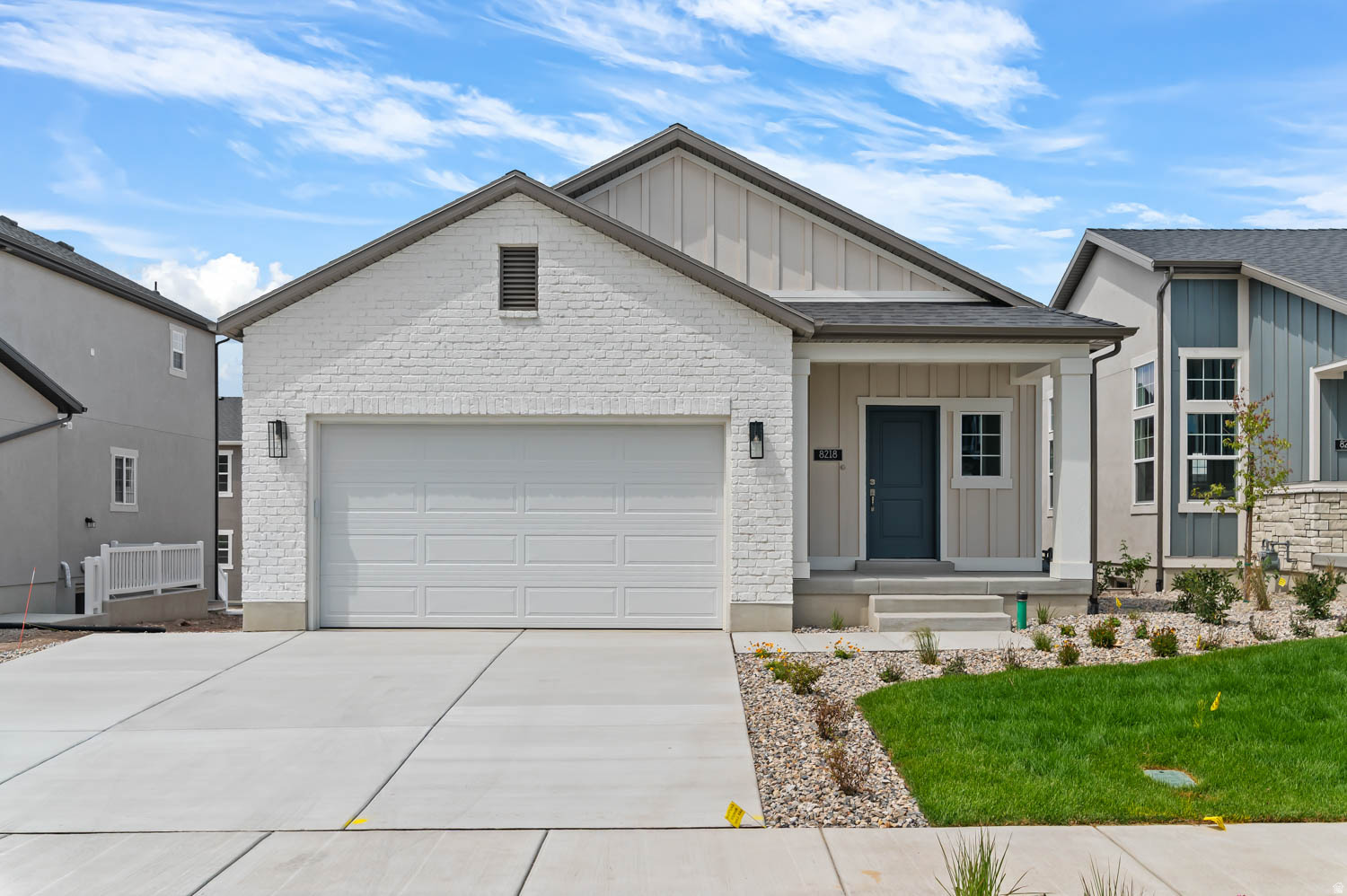 Come see this brand new Covington, a thoughtfully designed home featuring stylish finishes and functional living spaces! Enjoy a beautiful combination of laminate hardwood, luxury vinyl tile, and carpet flooring, complemented by Craftsman-style baseboards and casing and satin and brushed nickel hardware for a timeless finish. The spacious walk-up basement offers added flexibility for future expansion, recreation, or storage. The bright, modern kitchen is appointed with white laminate cabinetry, quartz countertops, and a stainless steel gas appliance package, creating the perfect space for everyday living and entertaining. The owner's suite provides a relaxing retreat with a walk-in shower featuring elegant glass doors. Energy-efficient features, including a tankless water heater, help maximize comfort and savings, while convenient Christmas light outlets make seasonal decorating a breeze. The home comes with the front yard landscaped and is also maintained by the HOA for easy care living. Blending quality craftsmanship, modern amenities, and versatile living spaces, the Covington is a home designed to fit today's lifestyle.
