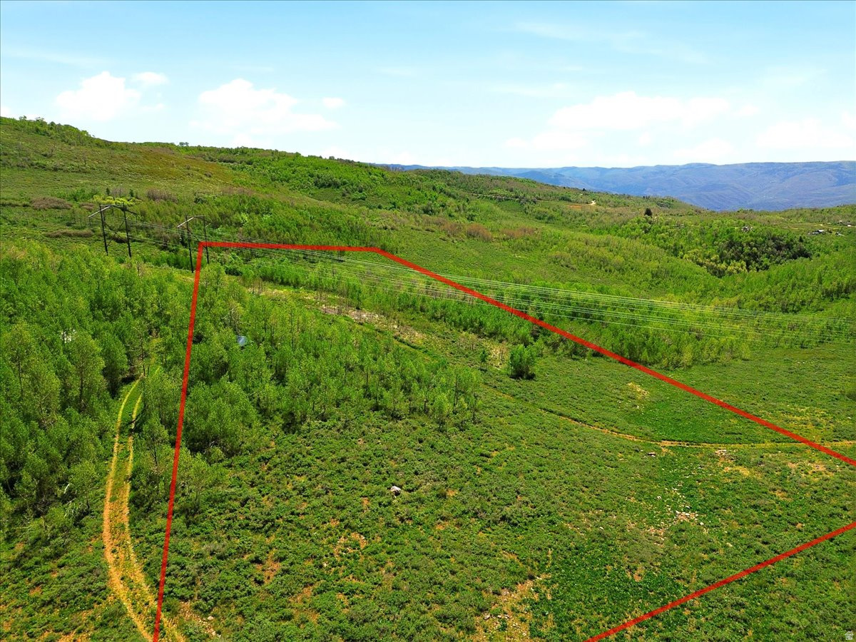 Discover the beauty and freedom of mountain living on this exceptional 10.96-acre property in Sunridge Huntsville. Rolling terrain, open space, and panoramic views of the surrounding mountains and valley create a setting that feels worlds away from the everyday. Whether you're looking for a recreational retreat, future homesite, or private getaway, this expansive parcel offers room to explore, unwind, and enjoy the natural landscape. With abundant wildlife, endless skies, and breathtaking scenery in every direction, opportunities like this are becoming increasingly rare.