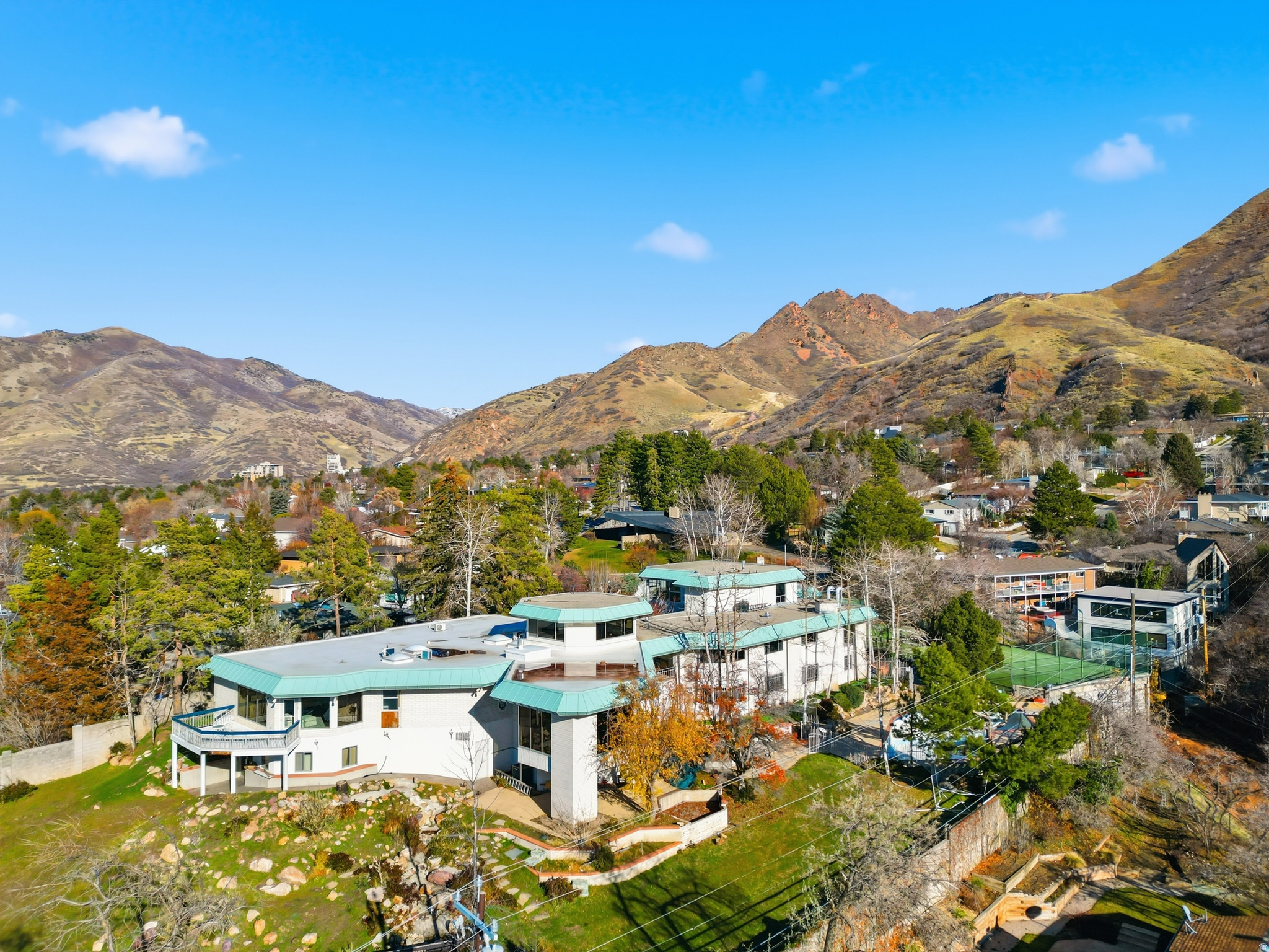 Rare, Unique opportunity with one-of-a-kind home located in the prestigious East Bench.  14,233 SQFT home, this beauty has the leverage to customize the home exactly how you want.  Located on 1.47 acres with complete valley views, this lot could be split into 2 or 3 lots to maximize profits or to give you leverage to make the home exactly how you want!  Structural features include an indoor lap pool, a large master suite, a Billiard room, a Bar area, several living spaces, and a suspended tennis court with a large storage space below. 6 Car garages and driveway are covered in beautiful decorative concrete work.