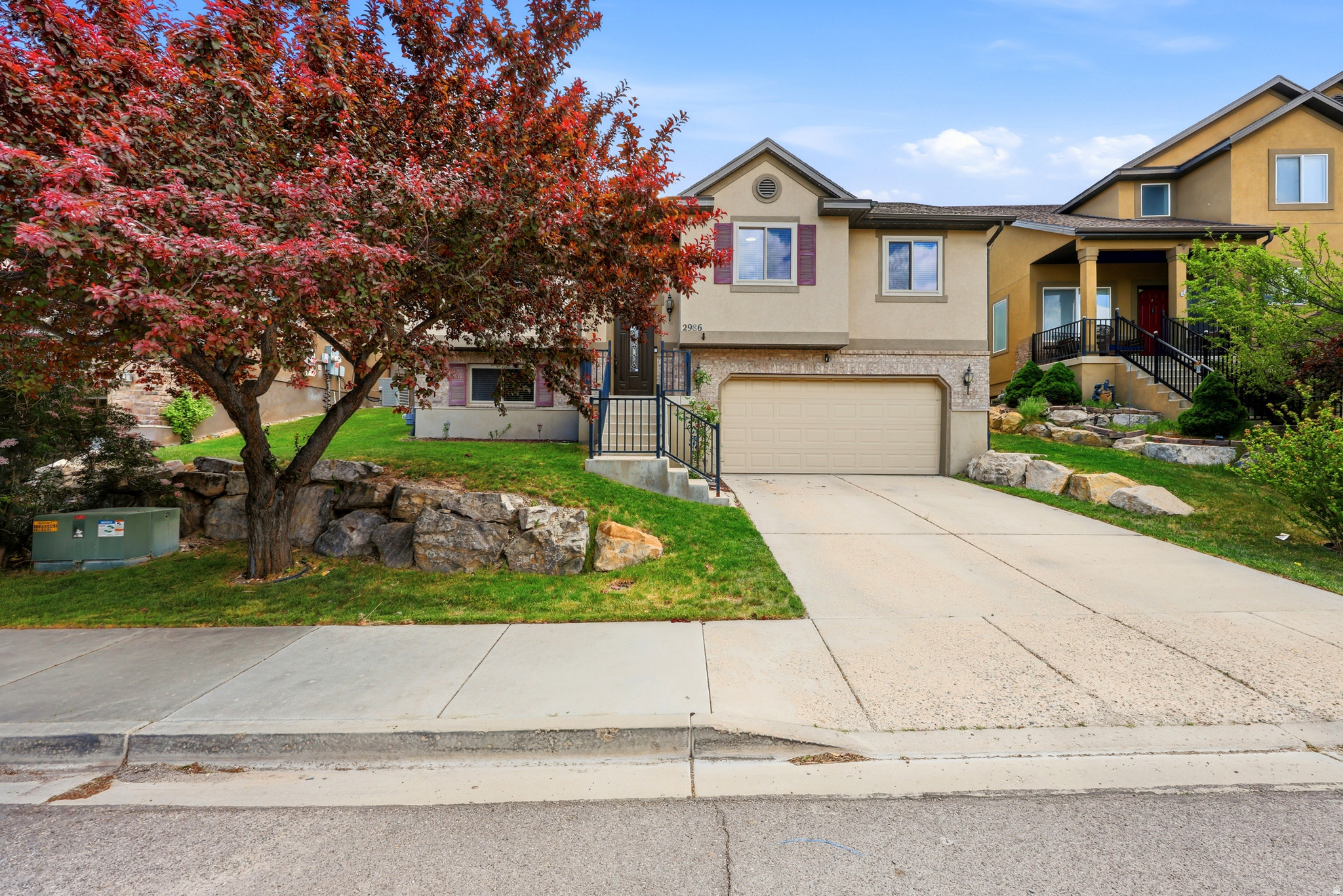 Move-in ready and located in The Ranches, this beautiful Eagle Mountain home backs to open space and offers direct trail access right from your backyard-with no HOA.  OVERSIZED 26' Deep Garage. The home features an exterior Jellyfish lighting system, reverse osmosis drinking water filtration at the kitchen sink, engineered hardwood flooring, and durable Corian countertops. The functional floor plan includes three bedrooms upstairs, while downstairs you'll find a third full bathroom and a versatile family room that works well as a playroom, home office, hobby space, or additional living area.  Start planting right away with a dedicated vegetable garden area featuring quality soil and drip irrigation already in place. A major recent upgrade includes energy-efficient windows that are just over a year old and come with a transferable warranty for the new owner.  Conveniently located just a four-minute walk from the neighborhood playground and splash pad and only minutes from shopping, dining, and everyday conveniences, this home combines comfort, convenience, and outdoor recreation in one exceptional package.  Contact Leah Duncan for a private showing. 385-286-7828.