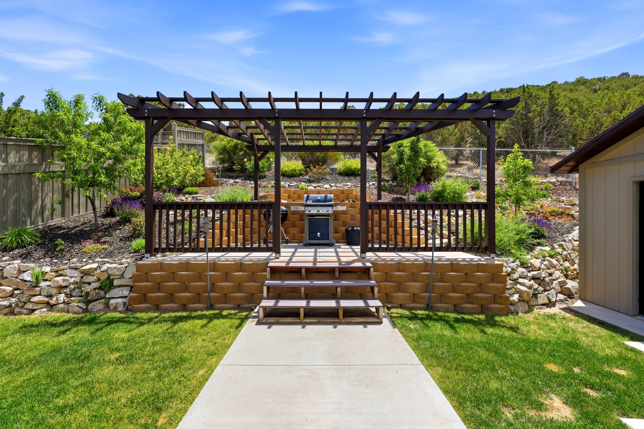 Move-in ready and located in The Ranches, this beautiful Eagle Mountain home backs to open space and offers direct trail access right from your backyard-with no HOA.  OVERSIZED 26' Deep Garage. The home features an exterior Jellyfish lighting system, reverse osmosis drinking water filtration at the kitchen sink, engineered hardwood flooring, and durable Corian countertops. The functional floor plan includes three bedrooms upstairs, while downstairs you'll find a third full bathroom and a versatile family room that works well as a playroom, home office, hobby space, or additional living area.  Start planting right away with a dedicated vegetable garden area featuring quality soil and drip irrigation already in place. A major recent upgrade includes energy-efficient windows that are just over a year old and come with a transferable warranty for the new owner.  Conveniently located just a four-minute walk from the neighborhood playground and splash pad and only minutes from shopping, dining, and everyday conveniences, this home combines comfort, convenience, and outdoor recreation in one exceptional package.  Contact Leah Duncan for a private showing. 385-286-7828.
