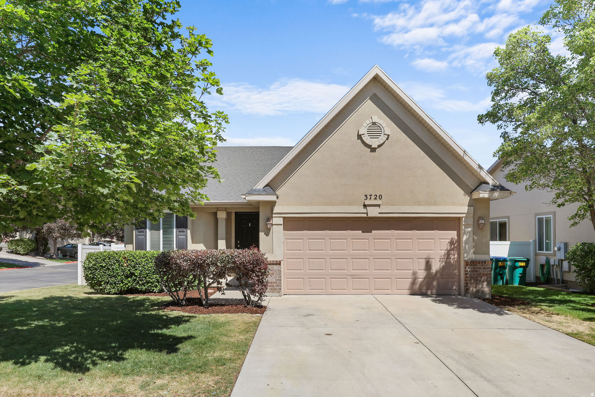 Tucked into a quiet corner lot in the heart of Lehi, this charming rambler delivers the perfect blend of thoughtful design, functional space, and an unbeatable location. The moment you step inside, a generous open floor plan welcomes you with soaring vaulted ceilings, a stylish ceiling fan, and a custom felt iron railing that adds a one of a kind touch to the front family room. The kitchen is truly the heart of the home, featuring stainless steel appliances, a large island with bar seating, vaulted ceilings, a convenient pantry, and a semi formal dining area that is perfect for everyday living and entertaining alike. A sliding glass door just off the kitchen opens to a fully fenced backyard that is ideal for weekend gatherings, outdoor play, and everything in between. Upstairs, the spacious primary suite impresses with double closets, vaulted ceilings, and a ceiling fan, while the en-suite bath offers double sinks and a large soaking tub for a true retreat feel. A second bedroom and full bathroom round out the upper level beautifully. Downstairs, the finished basement expands your living space significantly with three well sized bedrooms, each with closets, a full bathroom, a dedicated laundry room, and a generous family room that is made for hosting and making memories. The two car garage includes built in shelving for added storage and convenience. All of this sits just minutes from Thanksgiving Point, world class museums, the Thanksgiving Point Golf Course, and the thriving tech corridor that makes Lehi one of Utah's most sought after communities. This one checks every box. Schedule your private showing today. Buyer and Buyers agent to verify all information. Square footage figures are provided as a courtesy estimate only. Buyer is advised to obtain an independent measurement.
