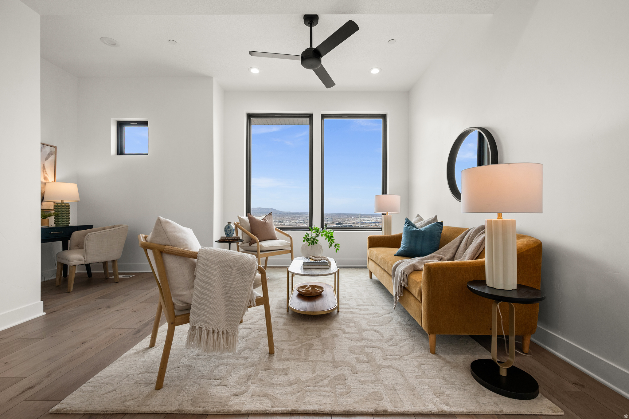Striking modern design and brand-new construction come together in this 3-bedroom, 3.5-bath townhome. Clean architectural lines, soaring ceilings, and expansive full-height windows create a light-filled interior, while wide-plank white oak flooring adds warmth and sophistication. The open-concept main level is designed for both everyday living and effortless entertaining. A sleek, contemporary kitchen features high-end custom cabinetry, modern tilework, and stainless appliances, offering a refined yet highly functional workspace. The living area opens to a private balcony, where unobstructed panoramic views showcase the Salt Lake Valley, evening city lights, and remarkable sunsets. Upstairs, the primary suite offers a quiet retreat with its own private balcony, a spa-inspired bath, and generous closet space. An additional bedroom with an ensuite bath and the conveniently located upper-level laundry add everyday ease. The lower level features a private ensuite bedroom with a separate entrance-ideal for guests, a home office, fitness space, or potential income opportunity. Thoughtfully designed and beautifully executed, this home offers a rare combination of modern architecture, functional living spaces, and exceptional natural light, with easy access to nearby trails, parks, shopping, dining, and commuter routes. Seller financing available.