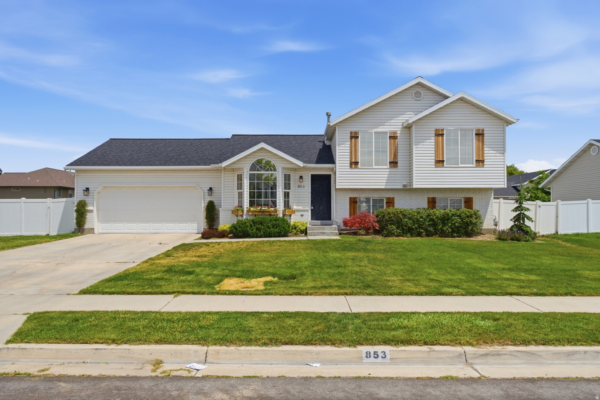 Beautifully maintained 4-bedroom, 2-bath home in the heart of Lehi. This inviting home features vaulted ceilings, an open-concept layout, multiple gathering spaces, and a cozy fireplace, creating the perfect blend of comfort and functionality. The bright kitchen offers ample cabinet space, a breakfast bar, and seamless flow into the main living areas. Step outside to enjoy a fully fenced backyard with a spacious patio, mature landscaping, and plenty of room to entertain, relax, or play, all while taking in beautiful mountain views. Ideally situated near Silicon Slopes, Thanksgiving Point, shopping, dining, parks, and top-rated schools, this home offers convenient access to everything that makes Lehi one of Utah's most desirable places to live.