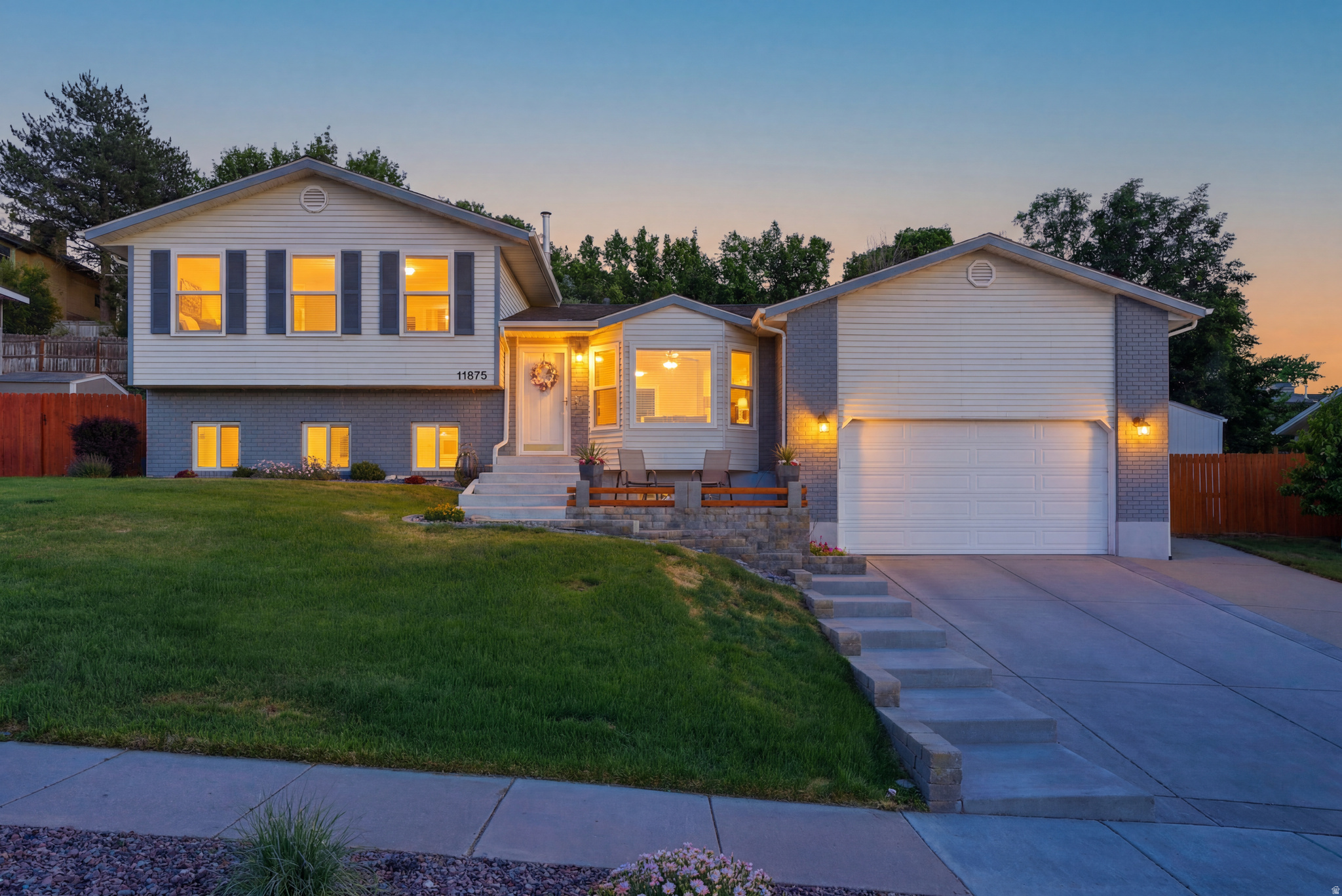Perched in the sought-after South Sandy foothills, this meticulously maintained 5-bedroom, 3-bathroom home offers the perfect blend of modern updates, breathtaking Salt Lake Valley views, and an unbeatable location. This move-in ready home delivers. Wake up to spectacular mountain surroundings and end each day with unforgettable sunsets from your own living room. New energy-efficient windows (2023) maximize the panoramic valley views. Thoughtfully updated interior features like luxury vinyl plank flooring throughout the main living areas, hallway, and stairs, along with a stunning fully remodeled primary ensuite completed in June 2022. Every major mechanical system has been addressed for peace of mind, including a newer roof, furnace (2020), water heater (2024), completely updated plumbing (2025), gutters with LeafFilter protection (2023), and new concrete driveway, garage floor, front steps, and backyard patio (2019). Imagine two spacious living areas, five bedrooms, three bathrooms, and an additional lower-level room currently staged as a fitness space that could easily serve as a home office, hobby room, or studio. Step outside to enjoy beautifully terraced landscaping with established perennials, raised garden beds ready for tomatoes and strawberries, peach trees ripe for the taking and a Tuff Shed (2020) providing additional storage for outdoor gear and seasonal equipment. Location is everything, and this home places you in the heart of it all. Approximately 19 minutes to Silicon Slopes, 25 minutes to Salt Lake City International Airport, 28 minutes to Snowbird Ski Resort, and easy access to Downtown Salt Lake City, world-class skiing, hiking, biking, shopping, dining, and outdoor recreation. Sprucewood Elementary and Indian Hills Middle School are both within an easy walk. Homes this extensively updated rarely come to market. Come and get it!