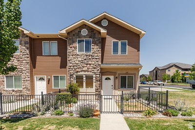 Welcome to Bridgerland Meadows! This beautifully maintained custom-built townhome is in the heart of Logan, Utah. Built in 2012 and owned by only one owner, this home was primarily used as a vacation property and only occupied for a couple of weeks each year, making it feel exceptionally clean, fresh, and gently lived in.  This desirable corner end unit offers the perfect combination of comfort, quality, and convenience. Located just minutes from shopping, restaurants, grocery stores, and everyday amenities, and in close proximity to Utah State University, Logan Regional Hospital, and Cache Valley Hospital, you'll enjoy both accessibility and a quiet, welcoming neighborhood atmosphere.  The home features:  2 bedrooms  1.5 bathrooms  Spacious 2-car garage  Granite countertops throughout the home  Under-cabinet kitchen lighting  Ceramic tile and laminate wood flooring  InstaHot water system at the kitchen sink  Refrigerator included  Alarm/security system  Upstairs, the spacious primary bathroom includes a relaxing soaking tub along with a separate walk-in shower, creating a comfortable private retreat.  Outside, the inviting front porch area is beautifully landscaped with flowers, bushes, and greenery that add warmth and curb appeal. The property also includes a built-in metal pergola/lattice structure designed for a canvas canopy cover - perfect for creating a shaded outdoor sitting area with patio furniture or a porch couch.  Residents of Bridgerland Meadows enjoy access to outstanding community amenities including:  Clubhouse  Pavilion available to reserve free of charge for gatherings and events  Fitness center/gym  Playground  Dog litter stations  Well-maintained common areas  The HOA provides convenient low-maintenance living by taking care of exterior building maintenance, roofs, landscaping, lawn care, sprinklers, snow removal, pest control, and private streets - helping keep the neighborhood clean, beautiful, and well cared for year-round.  This home is truly move-in ready and has been exceptionally cared for over the years. A rare opportunity to own a lightly used, upgraded end-unit townhome in one of Logan's most convenient locations.  Square footage figures are provided as a courtesy estimate only and were obtained from County records.  Buyer is advised to obtain an independent measurement.