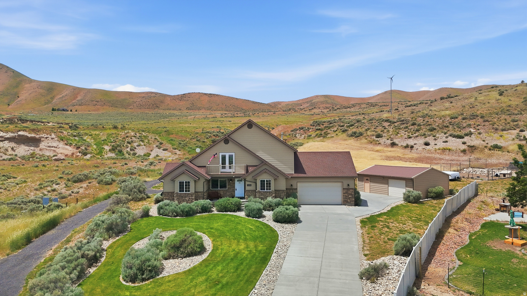 Welcome to this beautifully maintained custom home nestled on a quiet cul-de-sac in Thatcher's highly desirable Marble Hills subdivision. Perfectly positioned on a private 0.70-acre corner lot, this truly one-of-a-kind property offers absolutely breathtaking panoramic views in every direction - from the stunning Wasatch Front and sweeping valley views to unforgettable sunsets and sparkling city lights at night. Elevated above the valley floor, this home captures peaceful mountain living, fresh air, privacy, and scenery that is simply impossible to replicate. With over 3,600 square feet of thoughtfully designed living space, this spacious 5-bedroom, 3-bathroom home offers the perfect blend of comfort, functionality, and inviting gathering spaces. The oversized upstairs family room with walk-out balcony creates an incredible space for entertaining, relaxing, or simply soaking in the spectacular surroundings from nearly every window. The updated kitchen features beautifully painted cabinetry, updated hardware, stainless steel appliances, abundant storage, and a highly functional layout designed for both everyday living and hosting guests. Throughout the home, you'll find updated flooring, generous room sizes, main-floor laundry complete with washer and dryer, and a spacious primary suite complete with a walk-in closet and separate shower - all contributing to the warm, welcoming atmosphere this home provides. Outdoor living is equally impressive with a private courtyard-style patio surrounded by vinyl fencing, a pergola with retractable canopy, mature landscaping, vegetable garden space, playground area, and exceptional backyard privacy with no direct rear neighbors. The quiet cul-de-sac location provides minimal traffic and a peaceful setting that truly feels tucked away while still being conveniently located. The insulated and heated 22x30 shop wired for 220 power offers incredible flexibility for hobbies, storage, projects, recreational equipment, or workspace needs. Additional RV and toy parking, covered parking areas, outbuildings, emergency water storage, water softener, included patio furniture, and playground equipment make this property exceptionally well-equipped, meticulously cared for, and truly move-in ready. Additional features include a Simply Safe security system with carbon monoxide detection, regularly serviced HVAC systems, fiber optic internet availability, natural gas BBQ hookup, and fantastic indoor-outdoor living spaces designed to be enjoyed year-round. Homes like this rarely come available. From the unmatched views and peaceful setting to the exceptional level of care and maintenance throughout, this property offers a lifestyle that is hard to find and even harder to leave. Every inch of this home reflects pride of ownership and thoughtful upkeep, making it completely ready for its next owners to move in and enjoy from day one. Don't forget to check out the tour links featuring the video tour and immersive 3D walkthrough! Buyer to verify all information.