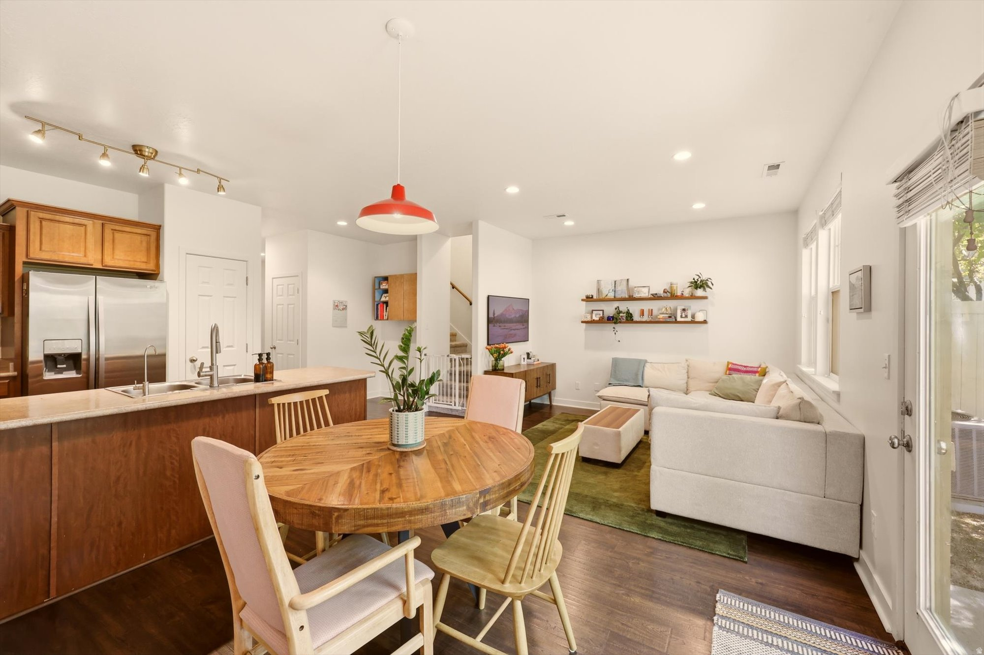 Townhomes often mean compromise. This one doesn't feel that way. Vaulted ceilings change the entire experience of the space.  When heading upstairs, the home opens up in a way that's rare for attached housing. Add in the filtered natural light coming through mature trees and fresh, thoughtful updates to the flooring, lighting, and paint, and this feels more like a standalone home than most townhomes you'll walk through. The primary bedroom is genuinely large, with a walk-in closet and a full bathroom that gives you the retreat you actually want at the end of the day. Outside your door, the HOA amenities include a pool, gym, clubhouse, and park. But the coverage goes well beyond that. Insurance, landscaping, snow removal, water, sewer, and trash are all included. For the right buyer, that kind of simplicity has real value. And then there's the location, which is the thing that will be hardest to find elsewhere. This is one of the genuinely walkable neighborhoods in Utah County, and that is a short list. Groceries, coffee, a playhouse and multiple restaurants are all within a five-minute walk. In a state where that's genuinely rare, it matters. One more thing worth noting: there is no rental cap restriction, so if life changes and you need to lease it out, that door is open. Come walk the neighborhood and see what walkable actually feels like. Seller offering 1/0 rate buy-down with preferred lender - 5.39% first-year rate available. Contact agent for details.