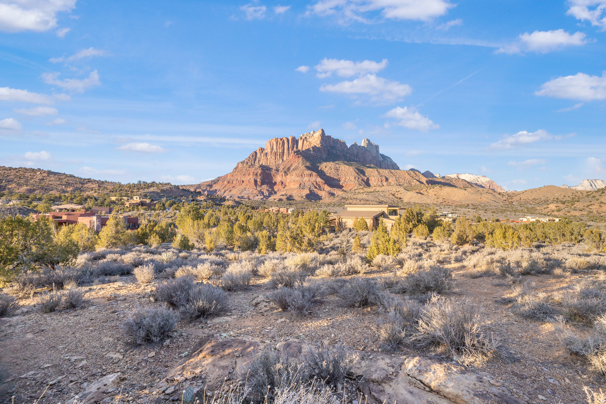 Experience million-dollar views for a fraction of the price on this premier Anasazi subdivision lot. Positioned just minutes from Zion National Park and steps from expansive BLM land, this property offers unmatched 360 panoramas of soaring red cliffs in a setting of total seclusion. You'll enjoy ultimate privacy tucked away from traffic, with a spacious 0.4-acre building pad nestled within 1.2 acres of dedicated open space and bordered by a permanent conservation easement. With utilities and high-speed fiber optic already stubbed to the site, the path to your custom desert sanctuary is perfectly streamlined. Pictures cannot capture the scale and serenity of this rare landscape-it is a must-see in person.