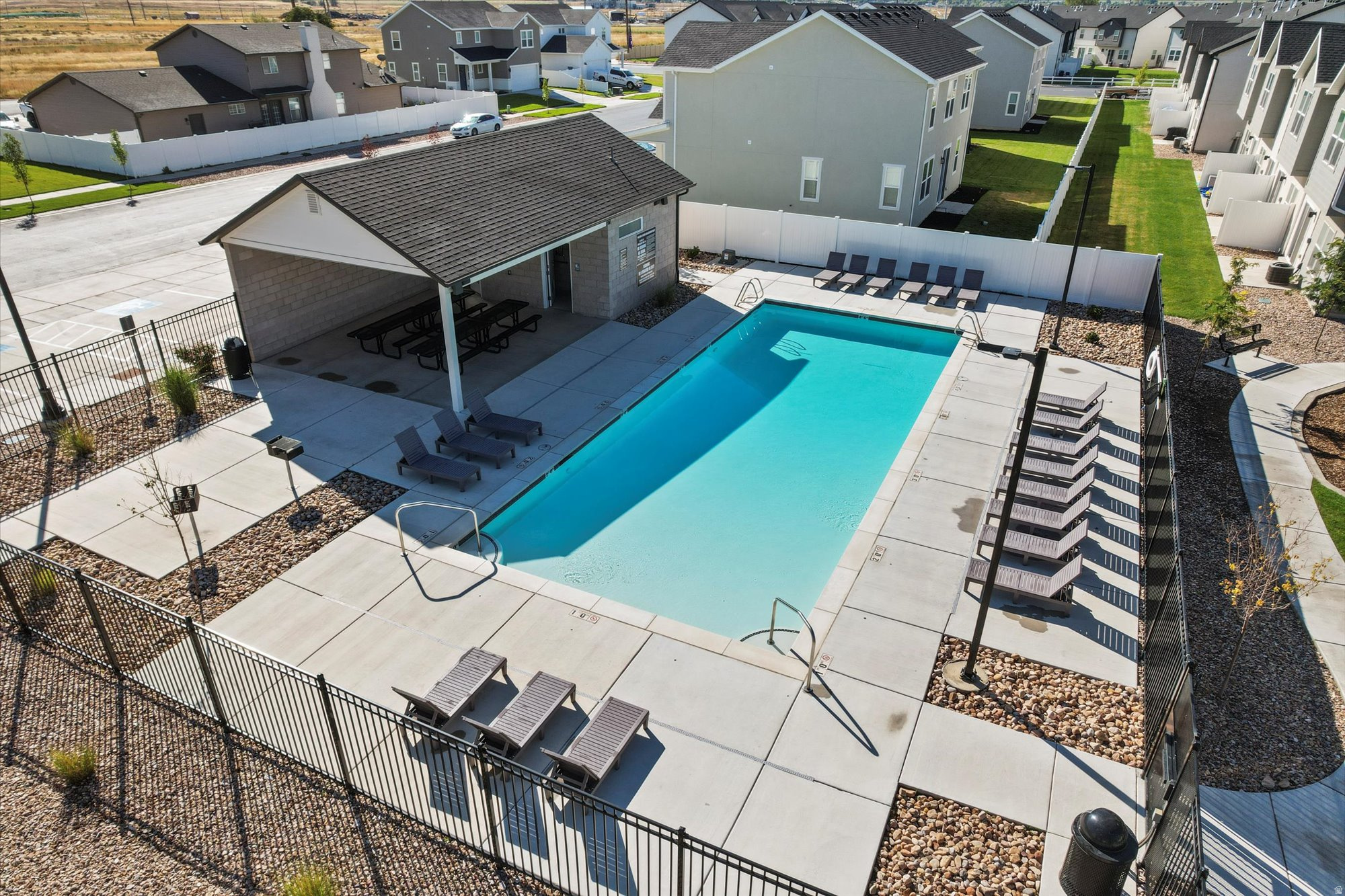 Nearly new END UNIT townhome with extra windows providing more light, nice upgrades, and a community swimming pool! Built in 2023, this home features 3 bedrooms, 2.5 bathrooms, nice loft area and an open concept living room and kitchen. This home offers both comfort and connectivity in a fantastic community! You'll love having the quick freeway access and low-maintenance living that's done right. Schedule your private showing today!  Square footage figures are provided as a courtesy estimate only and were obtained from County Record. Buyer is advised to obtain an independent measurement.