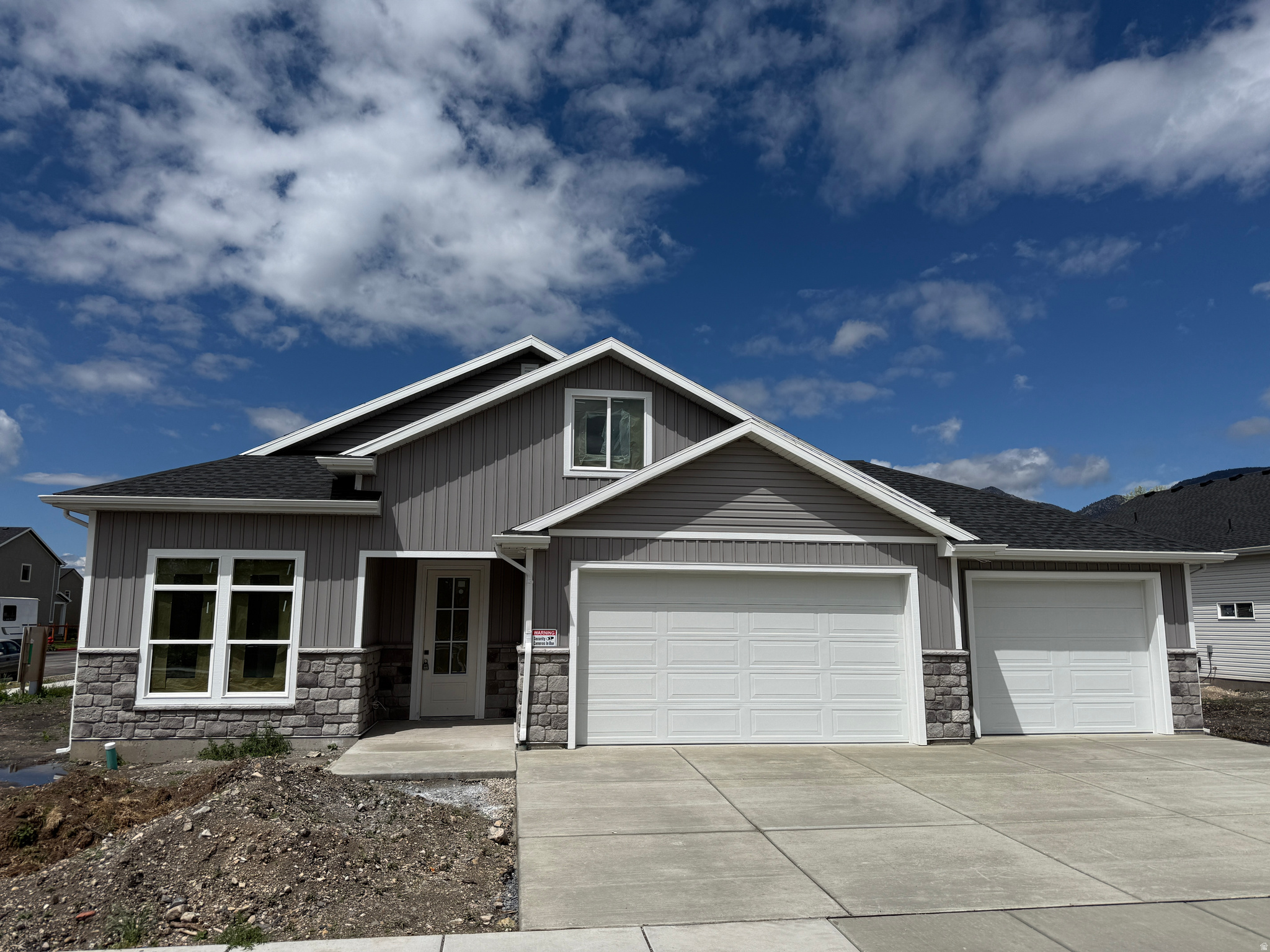 Amazing custom home with SINGLE LEVEL LIVING. Best of both worlds with a patio home main floor and large living area upstairs. Owners bedroom / bathroom suite, kitchen, family room and laundry are all on the main floor with a 2nd story with 2 bedrooms, family room and bathroom. This home features custom touches throughout, from the custom cabinets, quartz countertops, gas fireplace, walk-in pantry, large walk-in closets, high-end finish work, 3-tone paint, custom lighting, covered porch and so much more! All this on a nice South facing lot! Home is under construction with a completion estimate of late June to mid July.