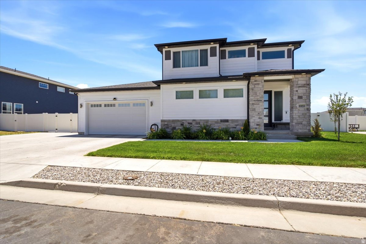 Built in 2022, this beautiful 4 bedroom, 2.5 bathroom home offers 2,424 sq. ft. of thoughtfully designed living space and all the upgrades already completed. Enjoy a fully landscaped yard with mature trees, full fencing, and a huge covered patio that creates the perfect outdoor living space for relaxing or entertaining.  The stunning two tone kitchen features wall ovens, a gas range, abundant cabinetry, and plenty of workspace for cooking and gathering. The open floor plan flows seamlessly into the living area, where a cozy fireplace creates a warm and inviting atmosphere.  A large flex space provides endless possibilities and can be used as a theater room, game room, home office, or additional family room. Comfort is enhanced with two furnaces for efficient heating throughout the home.  The extra deep 2 car garage offers plenty of room for vehicles, storage, tools, or recreational equipment. Best of all, there is no HOA, giving you more freedom and fewer monthly expenses.