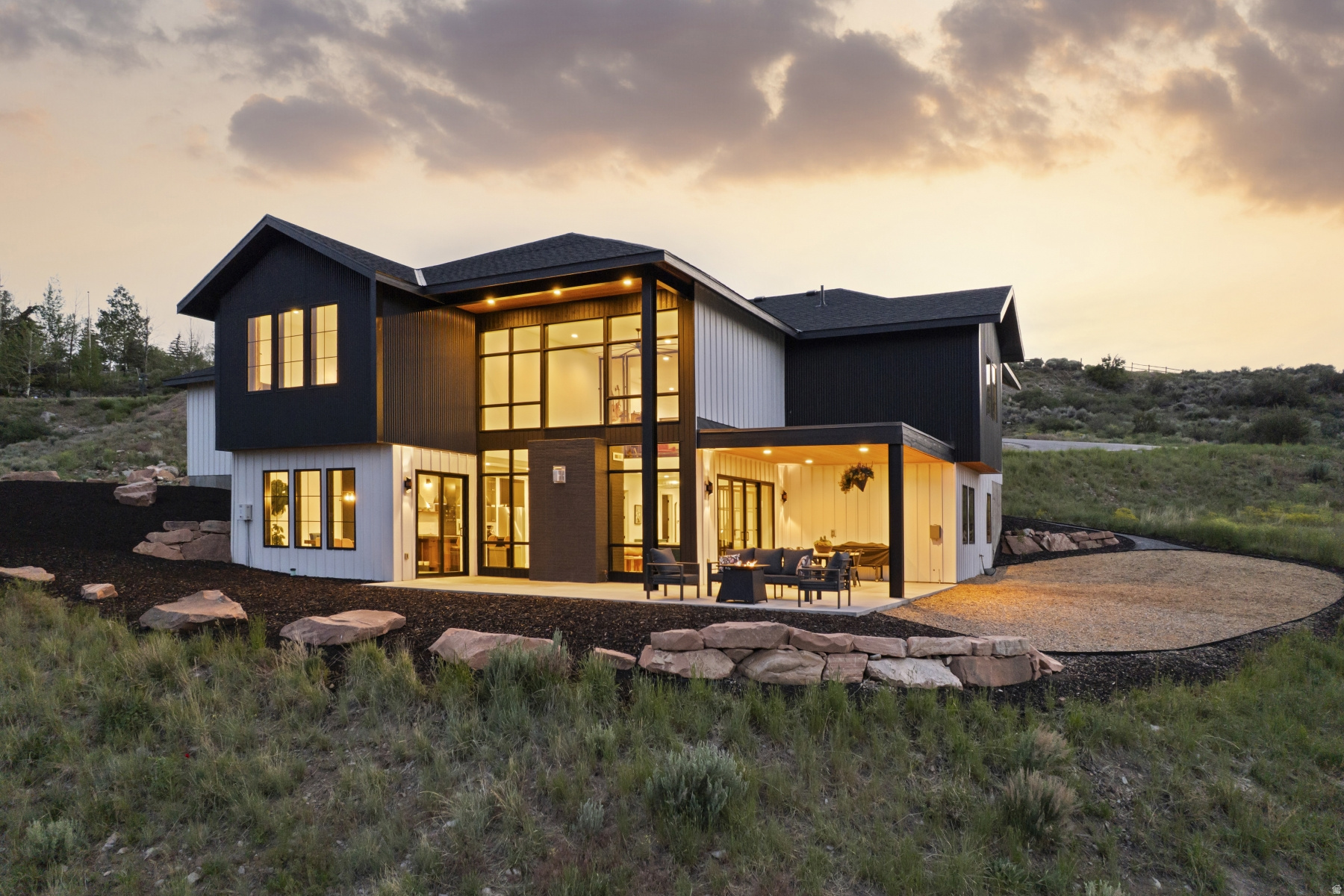 A rare Park City find on over 2 acres, 6180 Silver Sage Drive is a unique blend of newer construction, mountain views, usable land, horse property potential, and unforgettable modern industrial design. Built in 2023, this 4-bedroom, 5-bathroom home with a dedicated office/gym offers generous interior living and usable outdoor space, a hard-to-find combination in Park City. Nearby access to Trailside Bike Park, Round Valley, and Swaner Nature Preserve adds to the everyday lifestyle appeal.  Inside, it feels like a boho-industrial sanctuary: elevated, creative, and livable. Radiant-heated concrete floors, exposed steel, vaulted ceilings, and large windows offering natural light so you can truly appreciate the open land around you. The Japanese-inspired Kintsugi influence within the concrete flooring adds artistry, character and the uniqueness. Designed to capture north, east, and southern mountain views, while your covered deck offers shade at the perfect time for that afternoon read. It doesn't stop there, the oversized 3-car garage, RV parking, whole-house water filtration, and seamless indoor-outdoor living add everyday function to a property already defined by highly sought-after Park City versatility.  This home has impeccable vibes, come experience it for yourself! Out of respect for the property owners' privacy, the residence is shown by private appointment only. Please refrain from driving down the private driveway or visiting the property without a scheduled tour. We kindly ask that all showings be coordinated in advance through the listing agent.