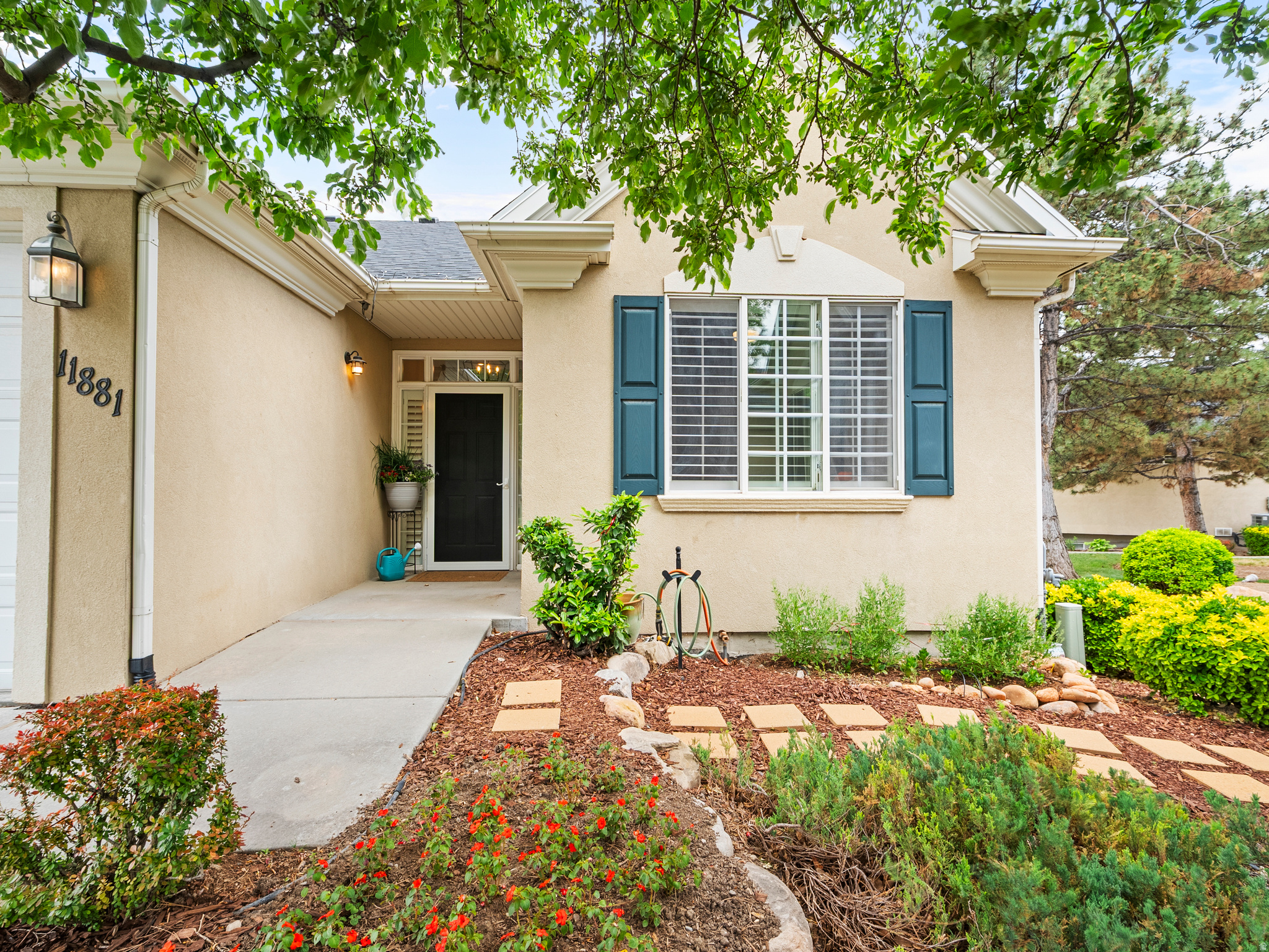 Welcome to luxury, low-maintenance living in the gated community of The Cottages in Draper! This beautifully updated condo offers 4 spacious bedrooms and 4 attached baths with  true main-level living. The remodeled main floor features custom cabinetry, quartz countertops, stainless steel appliances, 10' ceilings, plantation shutters, and expansive windows that fill the home with natural light. The spacious primary suite includes a walk-in closet and private ensuite bath, plus main-floor laundry for added convenience.  The brand new tree deck is perfect for enjoying the view of the Wasatch Front mountain range. The bright walk-out basement offers a second family room with a gas fireplace, 2 additional bedrooms attached to full baths, and separate entrance potential for a mother-in-law apartment or private guest space. Enjoy peaceful open green space behind the home for added privacy. HOA covers exterior maintenance, water, sewer, trash, internet, and insurance for easy living.