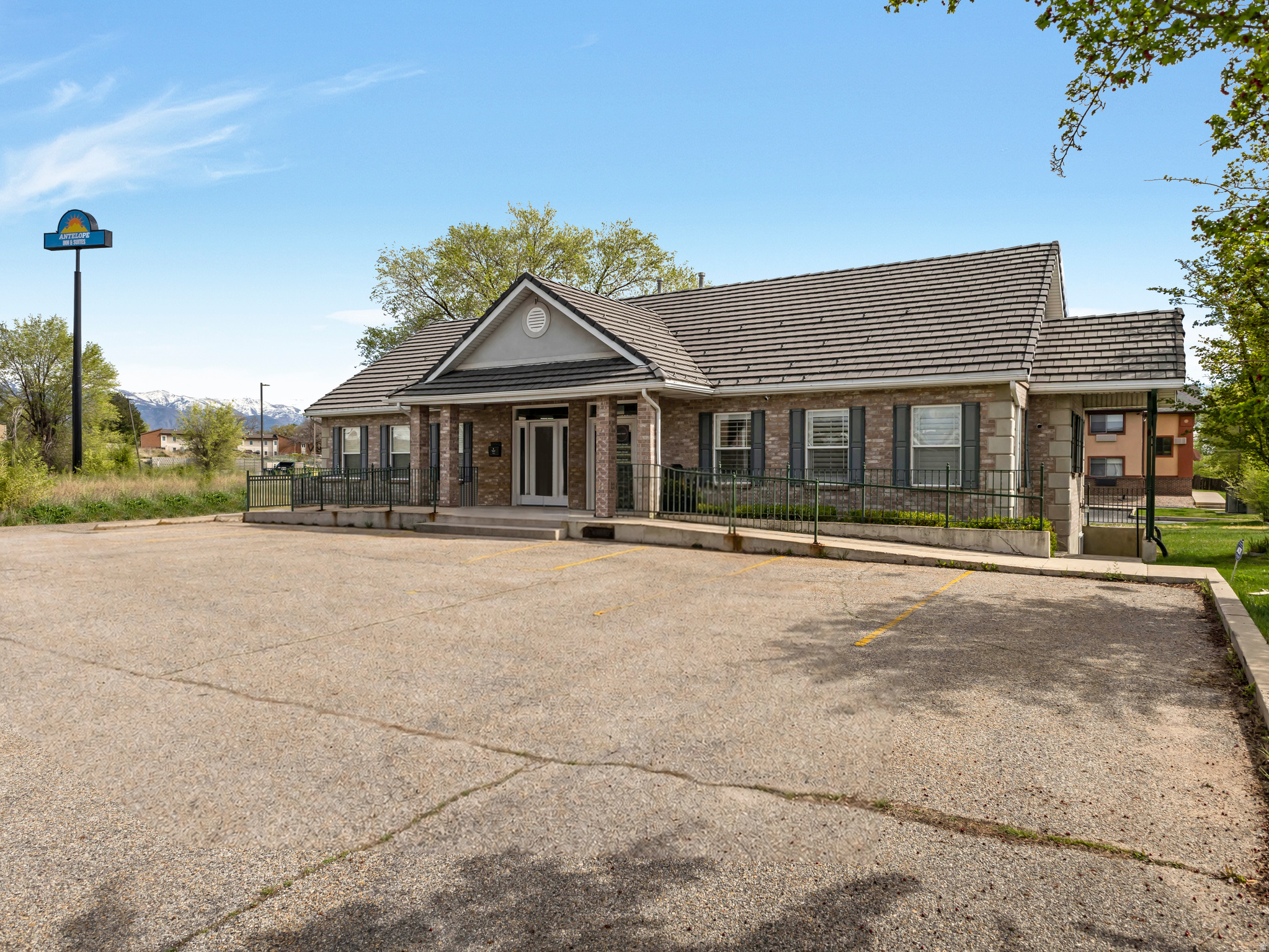 Are you looking for Prime Commercial Office Space that offers outstanding Visibility and High Traffic count? This Commercial Space is located next to I-15 and one of the Entrances to Hill Air Force Base.  There are 3 private offices upstairs and a bathroom, 2 private offices downstairs and a bathroom.  With a separate entrance to the basement, this set up is perfect for multi-tenant use. There is Signage and ample Parking. Call for more info and to set up your showing today.
