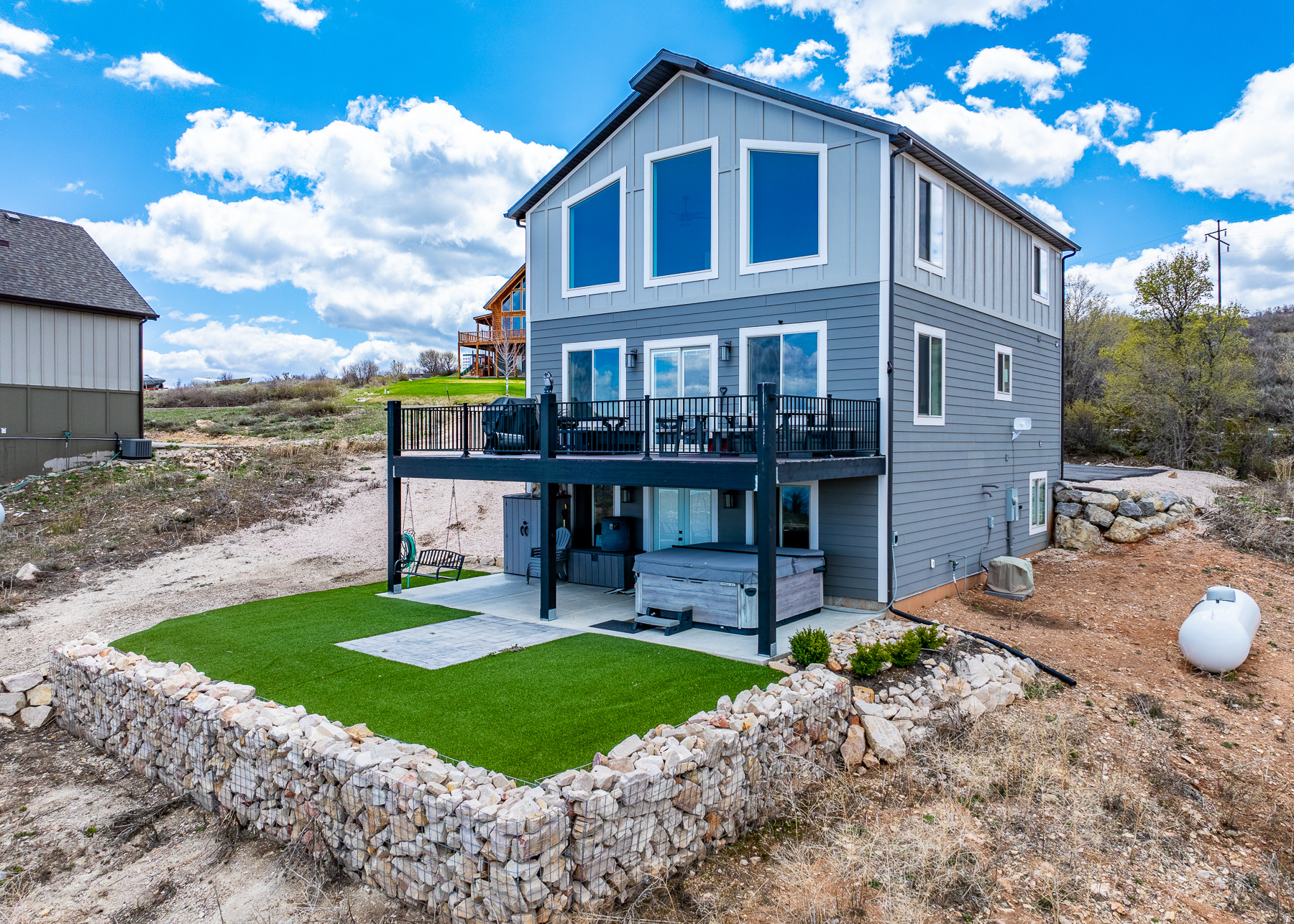 TURN KEY NIGHTLY RENTAL in beautiful Bear Lake!  Looking to buy an investment property? Now is the time!  Don't hesitate to buy this beautiful property and start investing in your fun! Unobstructed views of the lake!  Turn key nightly rental!  Sleeps 22.  Includes Bullfrog spa, turf grass, foosball table and Dbl shot basketball for fun entertainment.  Enjoy the full Bear Lake experience whether full time or part time and rent out when not using it!  Close to the Bear Lake State Park marina, Garden City bike path, shops and restaurants.  Call today to schedule an appointment!  Don't let this one pass you by!     Square footage figures are provided as a courtesy estimate only .  Buyer is advised to obtain an independent measurement.