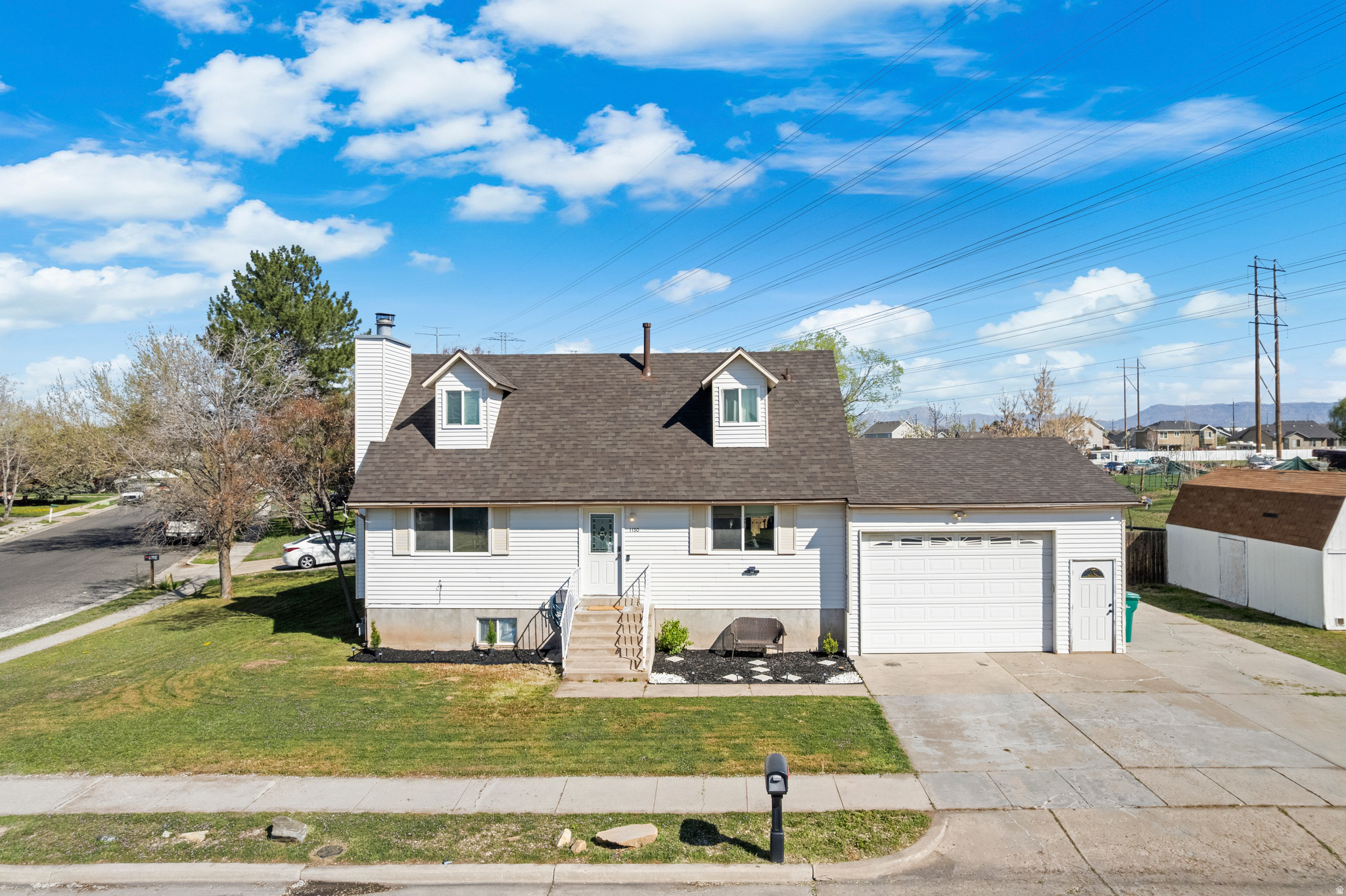 Positioned on a large corner lot with open views, this 5 bedroom, 3 bathroom home offers a functional layout with an open concept main level. The kitchen flows into the main living and dining areas, anchored by a large island and updated finishes.  A standout feature is the double level deck with access from both the kitchen and the primary suite, creating seamless indoor outdoor living.Backing to open land with horses next door and cows just across the street.  BRAND NEW ROOF and a fully fenced yard to complete the home, all with convenient access to shopping, commuting routes, and local amenities.  No Showings until Open House April 4th 12-2pm