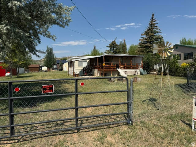 Mobile with addition on a large 3/4 acre in the Town of Manila. 28' x 40' garage, covered deck and patio. (deck 8' x 14') (patio 8' x 21') Lots of trees and open space, RV parking and a slide off the deck for the little ones.