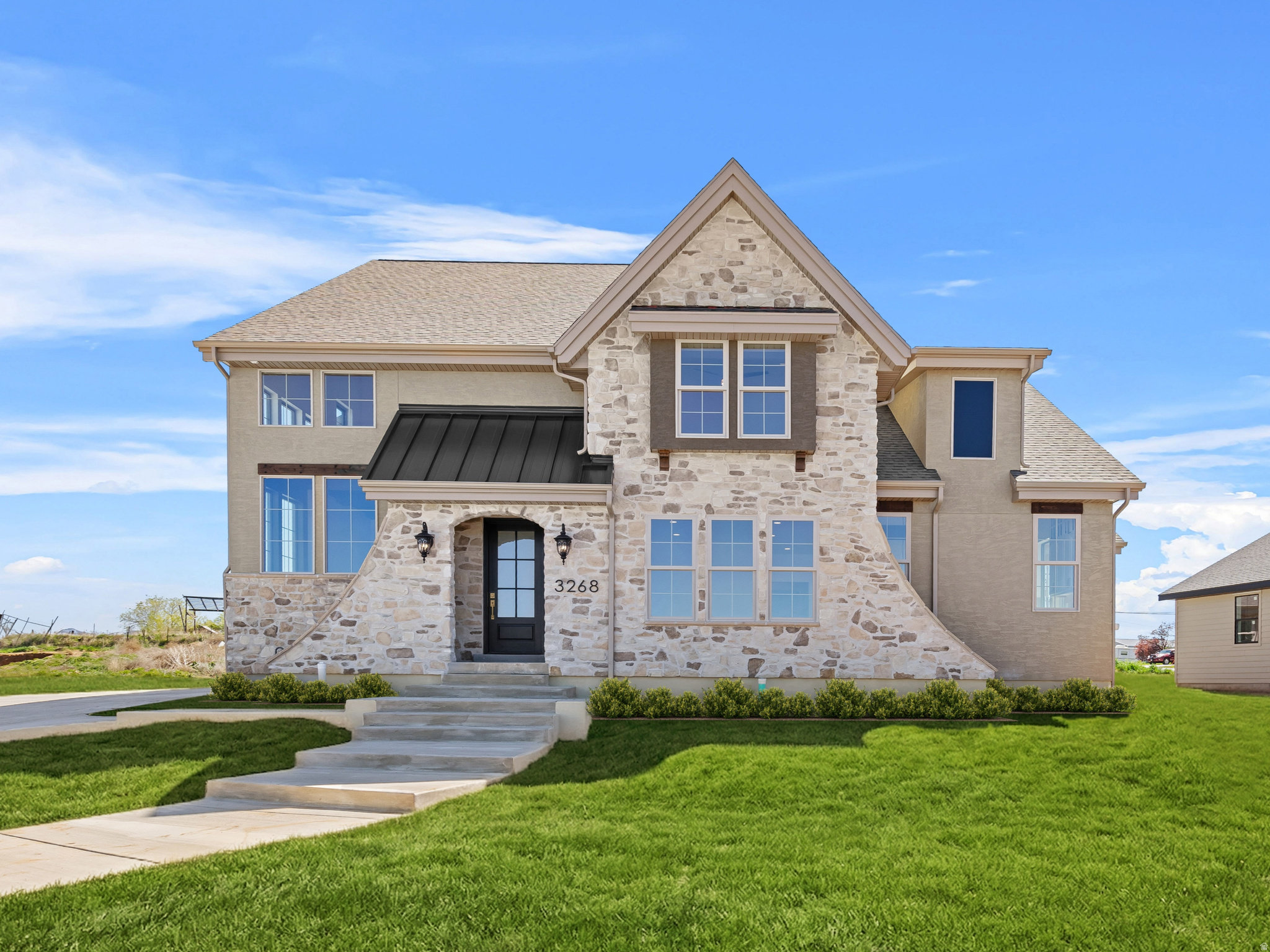 **Open House April 18 11-1** Unlike anything you've seen before! This stunning custom home offers the perfect blend of quiet country living with convenient access to nearby amenities. Built by Dalton Construction, this thoughtfully designed two-story home truly breaks the mold, featuring a fully separate, rentable ADU-ideal for extra income, guests, or multi-generational living. Step inside to a light-filled interior enhanced by an expansive window package that floods the home with natural daylight. The open-concept great room and kitchen showcase beautiful hardwood cabinetry in a rich walnut finish, extending to impressive 10-foot ceilings with under-cabinet lighting. Highlights include a custom 6-foot range hood, quartz countertops, and a show-stopping butler's pantry complete with a second sink, quartz surfaces, and direct access to the covered grilling porch. Durable, high-quality LVP flooring runs throughout the main level and ADU, offering both style and functionality. Relax by the elegant linear electric fireplace featuring a handcrafted mantel and hearth. The main-level primary suite is a true retreat, complete with an ensuite bathroom boasting a soaker tub, double vanity, custom-tiled shower, and a spacious walk-in closet. The ADU impresses with a vaulted great room, full kitchen with island, two bedrooms, a full bathroom, laundry area, and its own private garage. Upstairs, you'll find a second family room or rec space perfect for entertaining, along with three generously sized bedrooms and a full bathroom. Additional features include a covered back patio and an oversized four-car garage-perfect for vehicles, toys, and storage. This exceptional property delivers versatility, craftsmanship, and lifestyle all in one remarkable package.