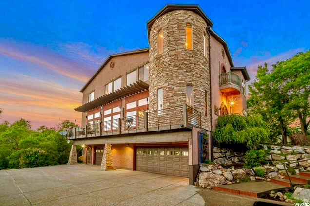 Located in the heart of Eden, this Tuscany-inspired eclectic home is filled with natural light and timeless character. The views of Nordic Valley and surrounding area are unmatched! Enjoy spacious living areas, a large back deck perfect for entertaining, and a walk-out lower level offering added flexibility and convenience. Surrounded by year-round recreation, you're just minutes from 3 world-class ski resorts, Wolf Creek Golf Course, Pineview Reservoir, and endless hiking and biking trails. Experience the perfect blend of style, comfort, and adventure in one of Ogden Valley's most desirable locations. Square footage figures are provided as a courtesy estimate only. Buyer is advised to obtain an independent measurement.