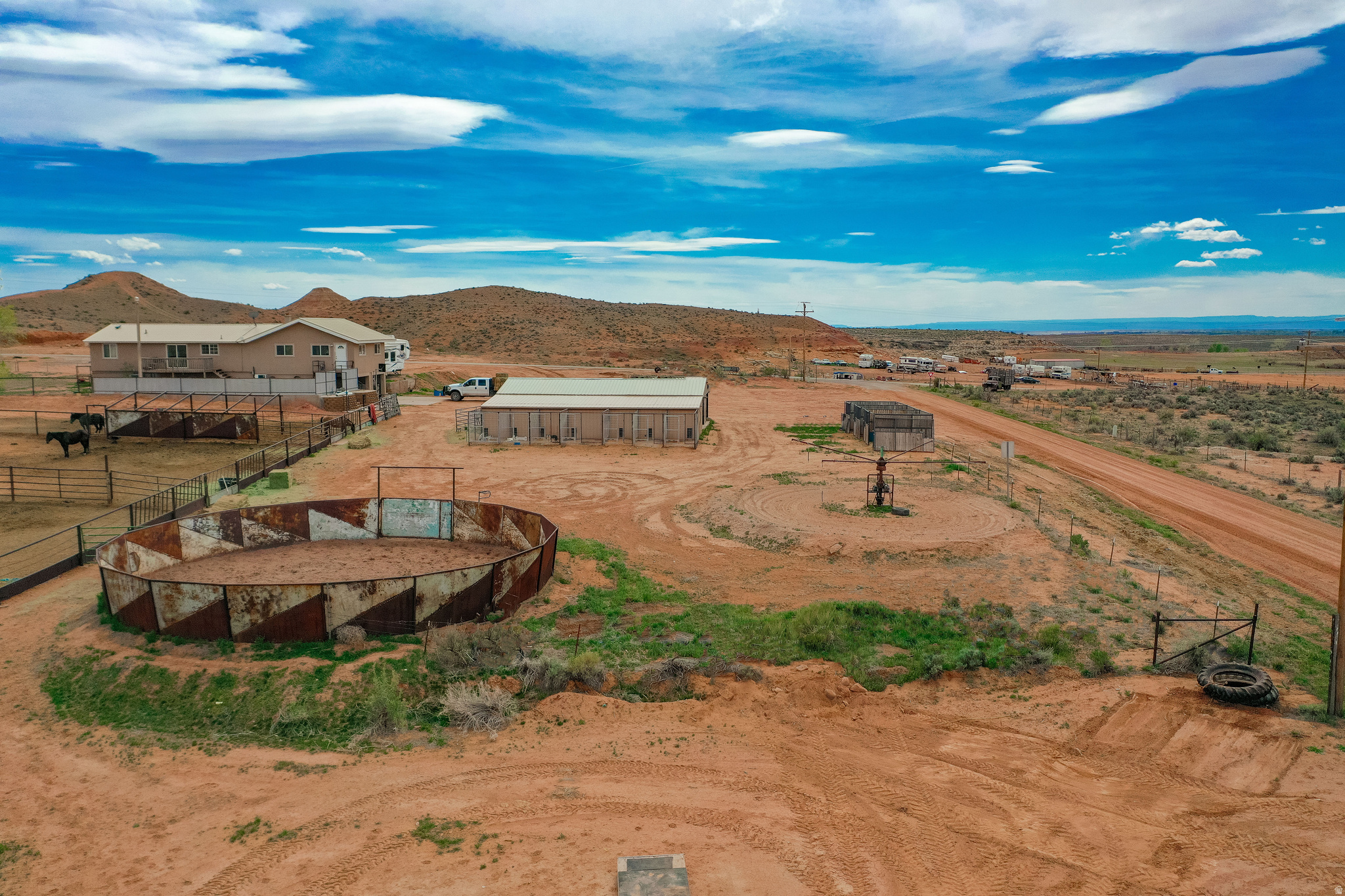Dream Horse Property with Exceptional Amenities!  This incredible horse property is fully equipped for both functionality and enjoyment. The outdoor arena features automatic chutes, lighting, and power-perfect for training and events. Additional equestrian amenities include a round pen, multiple corrals, a horse walker, and outdoor stables.  A dedicated saddle shop area includes an indoor/outdoor dog kennel, offering convenience for both riders and their companions. The detached shop/garage provides ample space for parking, equipment, and all your extra storage needs. The home is a spacious rambler with a full basement, offering generous living areas ideal for entertaining and comfortable everyday living. A separate mobile home on the property provides excellent accommodations for guests, extended family, or potential rental income. All information is deemed reliable. Buyer is advised to obtain independent information.