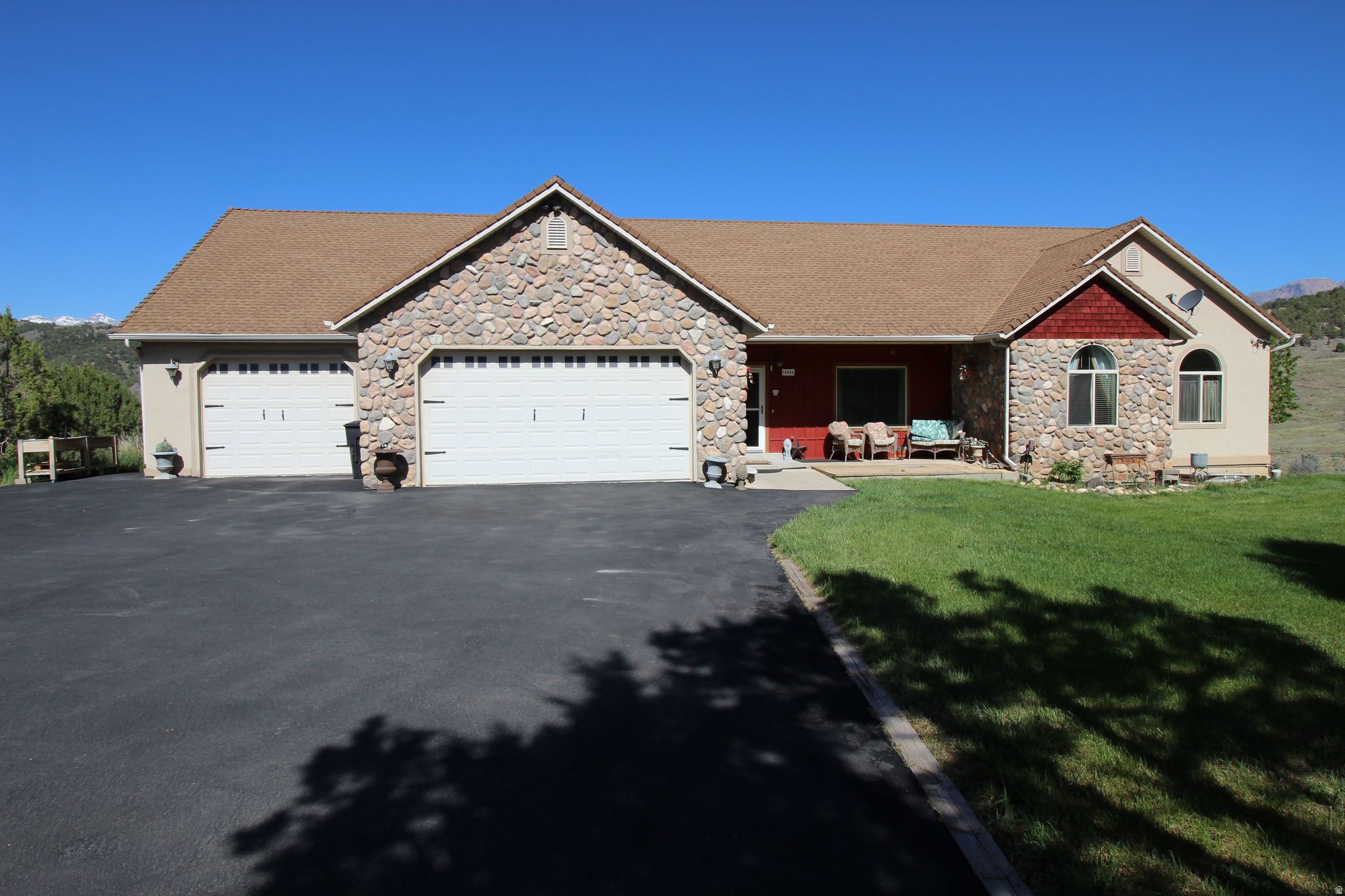 Elegant home with 6 bedrooms, office, 3 baths, 2 family rooms and gorgeous kitchen!  Loaded with extras including upgraded carpets, hardwood floors, jetted tub, 2 gas fireplaces plus a wood burning stove.  Enjoy the vaulted ceilings, large laundry room with sink and folding counter, ands spacious dining area with wonderful valley views! Big  3  garage on the main level plus another 2-3 car garage below (32' deep plus an adjoining 15' x 25' storage room).  This could be a  Huge workshop area!!   BRING YOUR HORSES - a nice double corral is already built!  Wonderful 1 Acre Lot with lots of seclusion next to a large common area.  2" x 6" construction and  protected by a Fire-Sprinkler System. Enjoy Country Living at its best!  Only a short 25 minute drive to Spanish Fork - it's not that far to town.   Square footage figures are provided as a courtesy estimate only and were obtained from Utah County.  Buyer is advised to obtain an independent measurement.