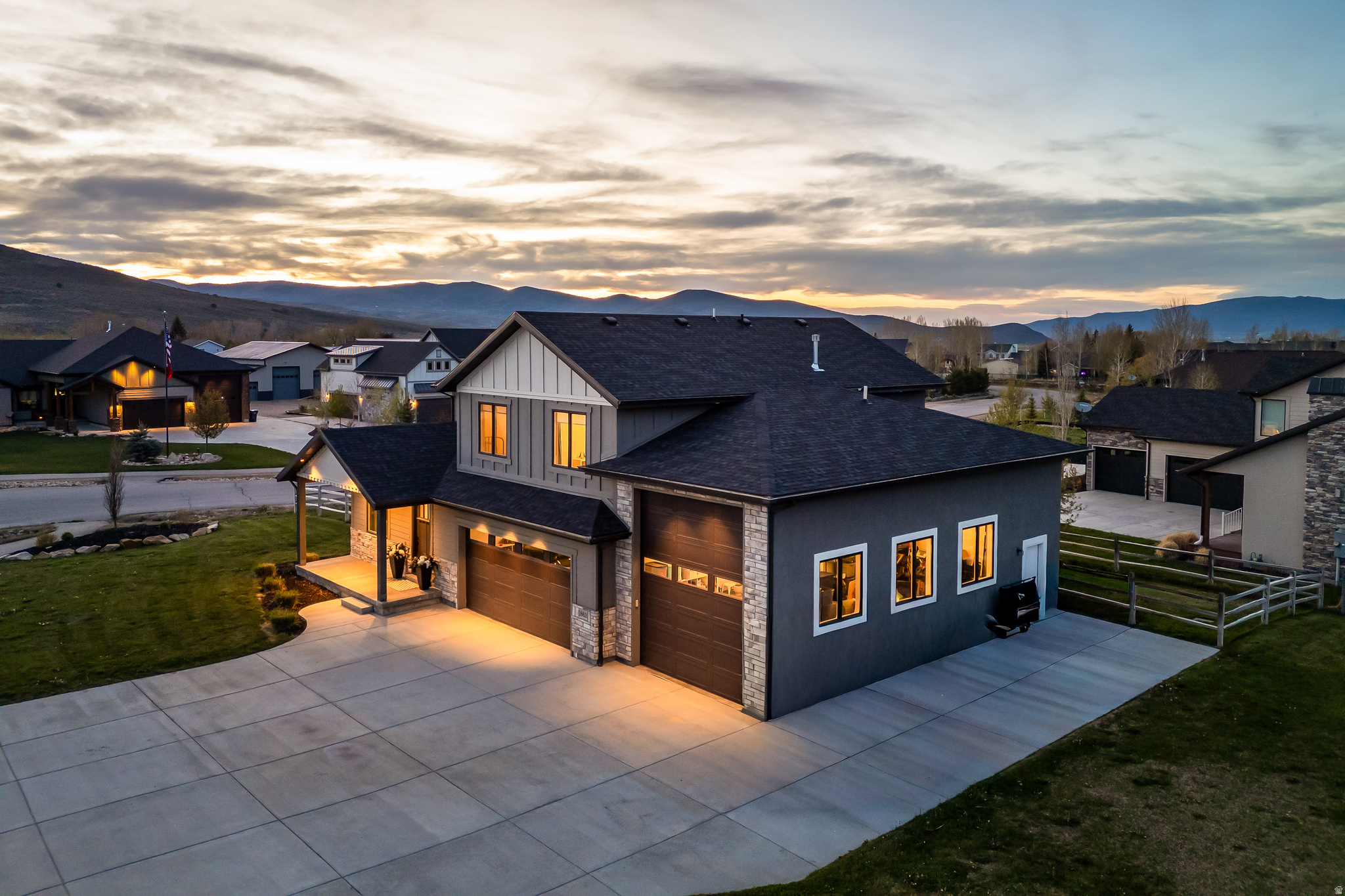 Set on a rare .41-acre lot in the desirable Hilltop Ridge neighborhood, this thoughtfully designed home offers space, privacy, and flexibility(no HOA!) that are increasingly hard to find. Tucked at the corner of a quiet cul-de-sac, the lot provides room to build and is located steps from South Summit school bus stops. Inside, the open-concept layout is filled with natural light from expansive windows and elevated by soaring ceilings that create an airy, welcoming feel. The great room is anchored by a striking fireplace, making it a natural gathering space for everyday living and entertaining. The kitchen blends warmth and functionality with custom cabinetry, a large center island, and modern finishes ideal for hosting or daily use. Indoor living flows seamlessly outdoors to multiple patio and deck spaces--perfect for summer dining, morning coffee, or unwinding in the included hot tub overlooking the fully fenced backyard. The oversized RV garage adds rare versatility, easily accommodating adventure vehicles, storage, or a workshop, home gym, or hobby space. The expansive lot allows room for a future ADU, home expansion, or enhanced outdoor amenities--flexibility rarely available in this area. Located minutes from the Mirror Lake Highway and the backcountry of the Uinta Mountains, and less than 20 minutes from the new Deer Valley East Village, this home offers year-round recreation while maintaining the charm and quiet of Kamas Valley living. A rare blend of land, lifestyle, and long-term potential.
