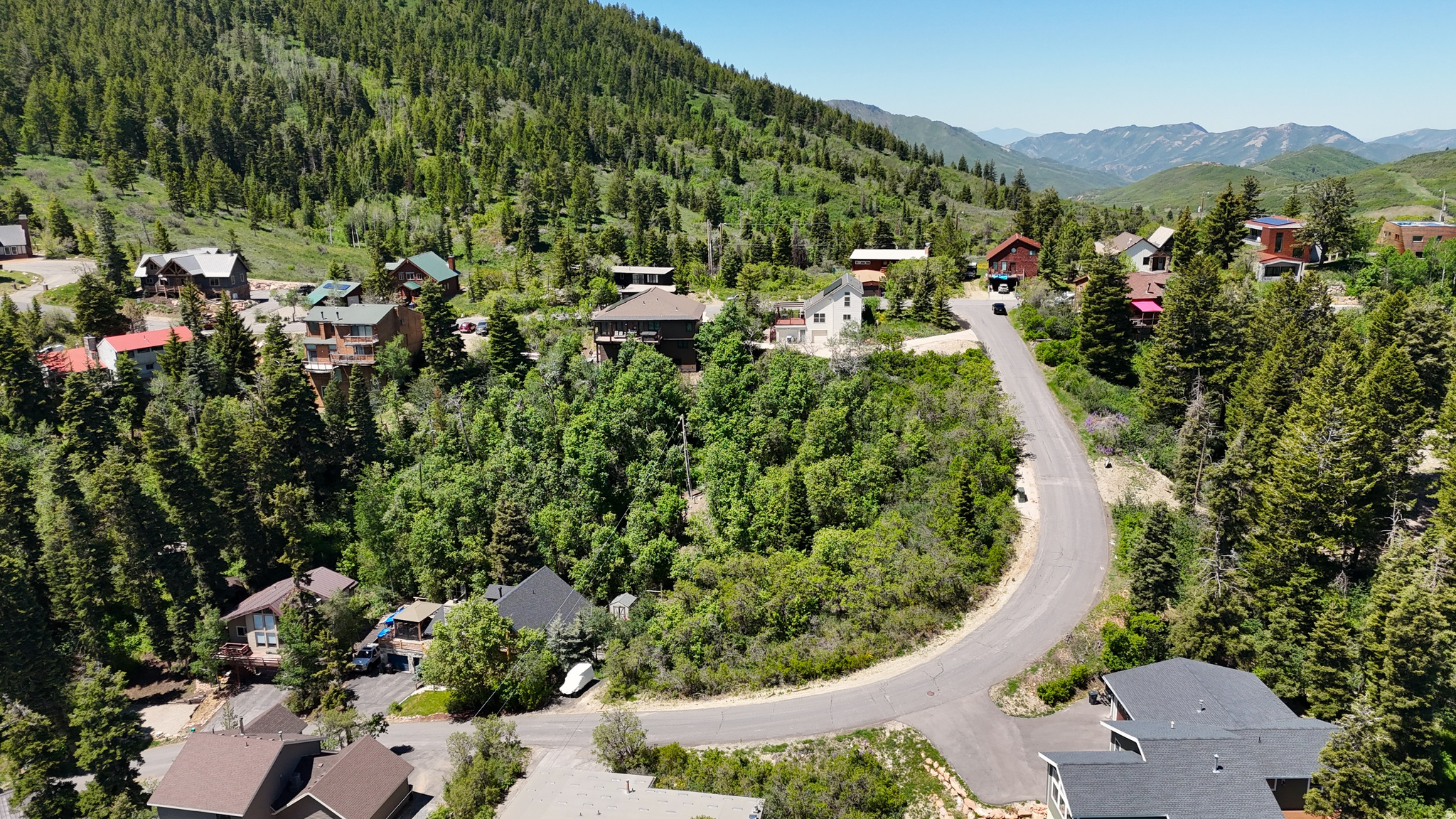 If you've been searching for the ideal Summit Park lot with all-day sun, panoramic views, easy access, and a gentle grade, your search ends here. Situated on a bend in the road, this nearly -acre Park City lot offers exceptional privacy with multiple options for driveway placement and home orientation. Preliminary building sketches are included with the sale and featured in the photos, helping you envision your future home on this rare Summit Park offering. Gas, water, power, and internet are available, and roads are county maintained. Located within the Park City School District and just minutes from world-class skiing, Historic Park City Main Street, and Salt Lake City International Airport. Summit Park offers outstanding trails and backcountry skiing, while dining, shopping, and groceries are conveniently located in Quarry Village. Nearby, Woodward Park City provides year-round action sports and recreation. The HOA is voluntary and nightly rentals permitted.