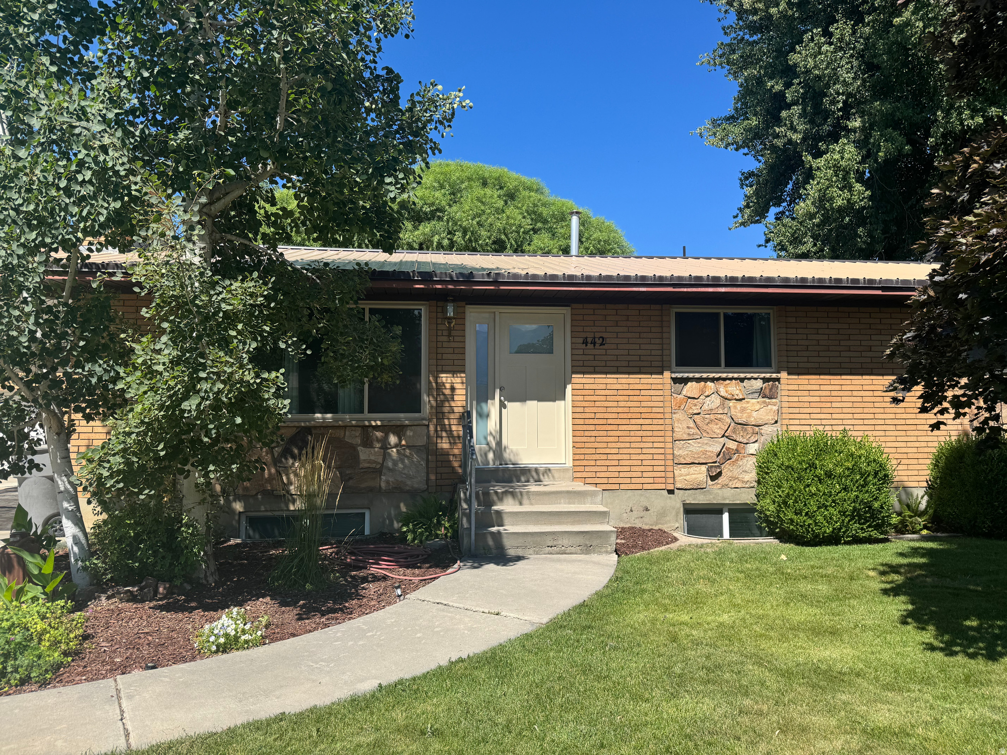 This house is a Must-See! Newly Remodeled with new cabinets, countertops, flooring, paint, exterior doors, and windows on the main floor. New Carpet in the basement. Oversized carport. Huge detached garage/shop with mechanic's pit. Besides the main RV parking next to the driveway, there is a pad behind the gates on the opposite side for storing a boat or an enclosed trailer. It can be used as a shady patio. Close to shopping, parks, and freeway access in a well-maintained neighborhood.  Square footage figures are provided as a courtesy estimate only and were obtained from the County.  Buyer is advised to obtain an independent measurement.