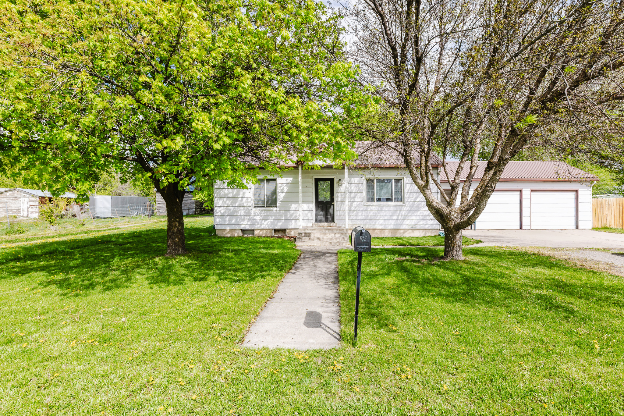 Charming remodeled home on the west side of Logan blending classic character with modern updates! Originally built in 1942, this 3 bedroom, 2 bathroom home features an updated interior with a beautifully remodeled kitchen, cozy living space, and functional single-level living with all bedrooms and bathrooms on the main floor. Situated on a .18-acre lot, the property offers mature trees, a spacious yard, covered patio, and plenty of outdoor space to relax or entertain. Conveniently located near schools, parks, and shopping while still offering a quiet neighborhood feel.  Square footage figures are provided as a courtesy estimate only. Buyer is advised to obtain an independent measurement.